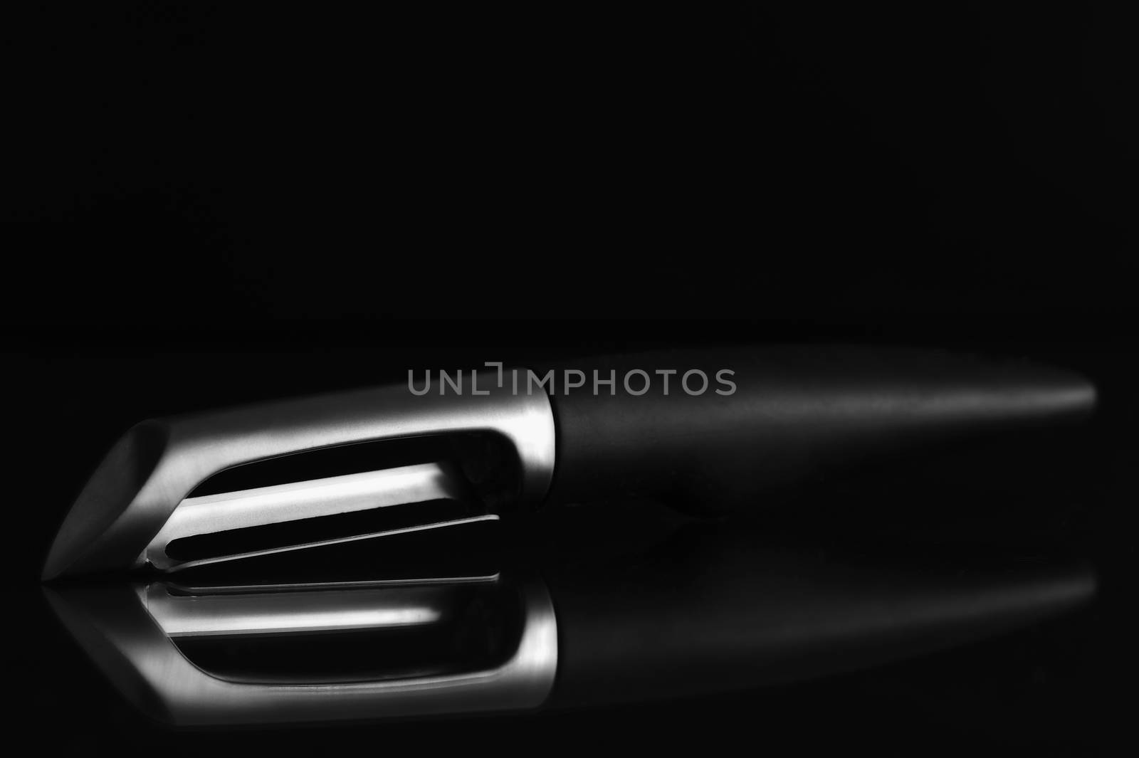 Vegetable corer and peeler isolated on black.