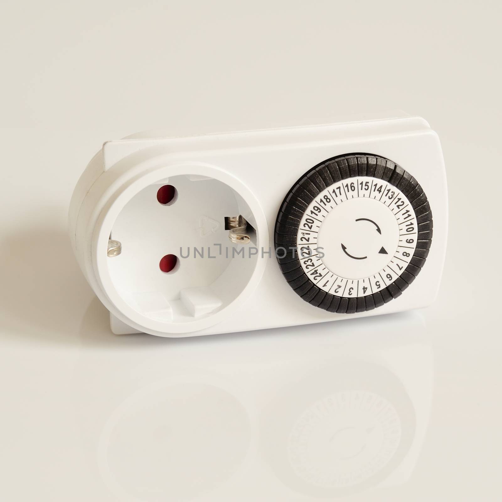 White electric timer on isolated background.
