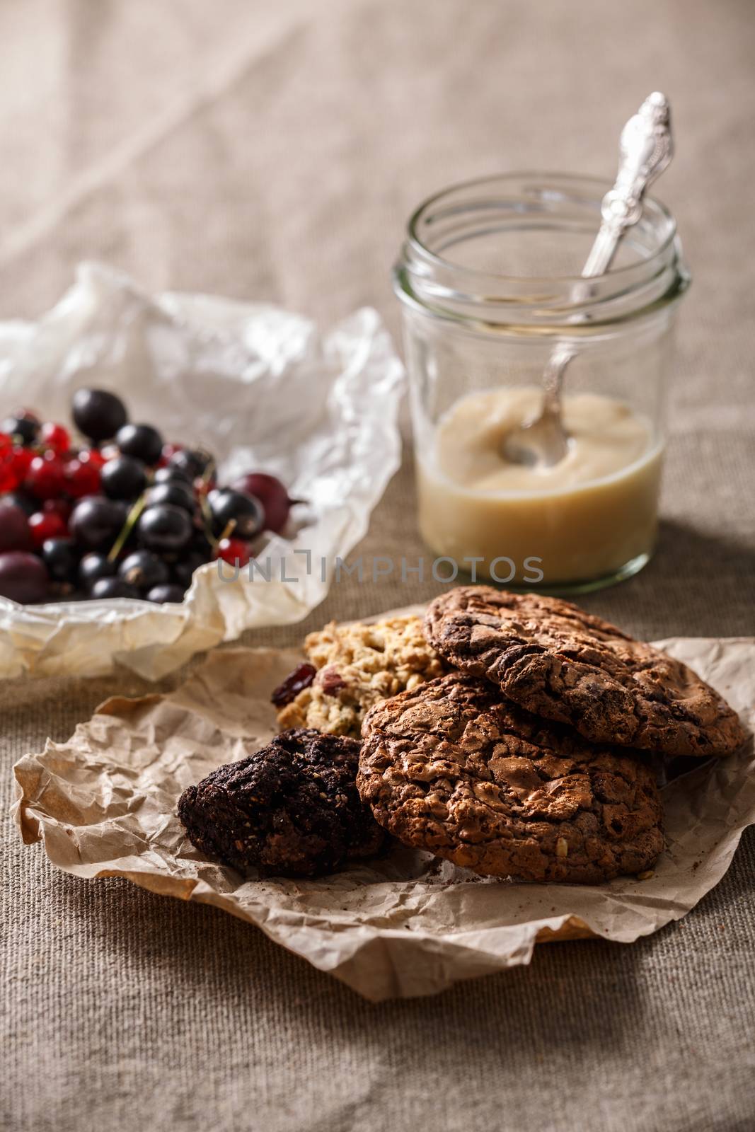 Healthy breakfast. Chocolate chip and oatmeal cookies, yogurt and fresh currant berries