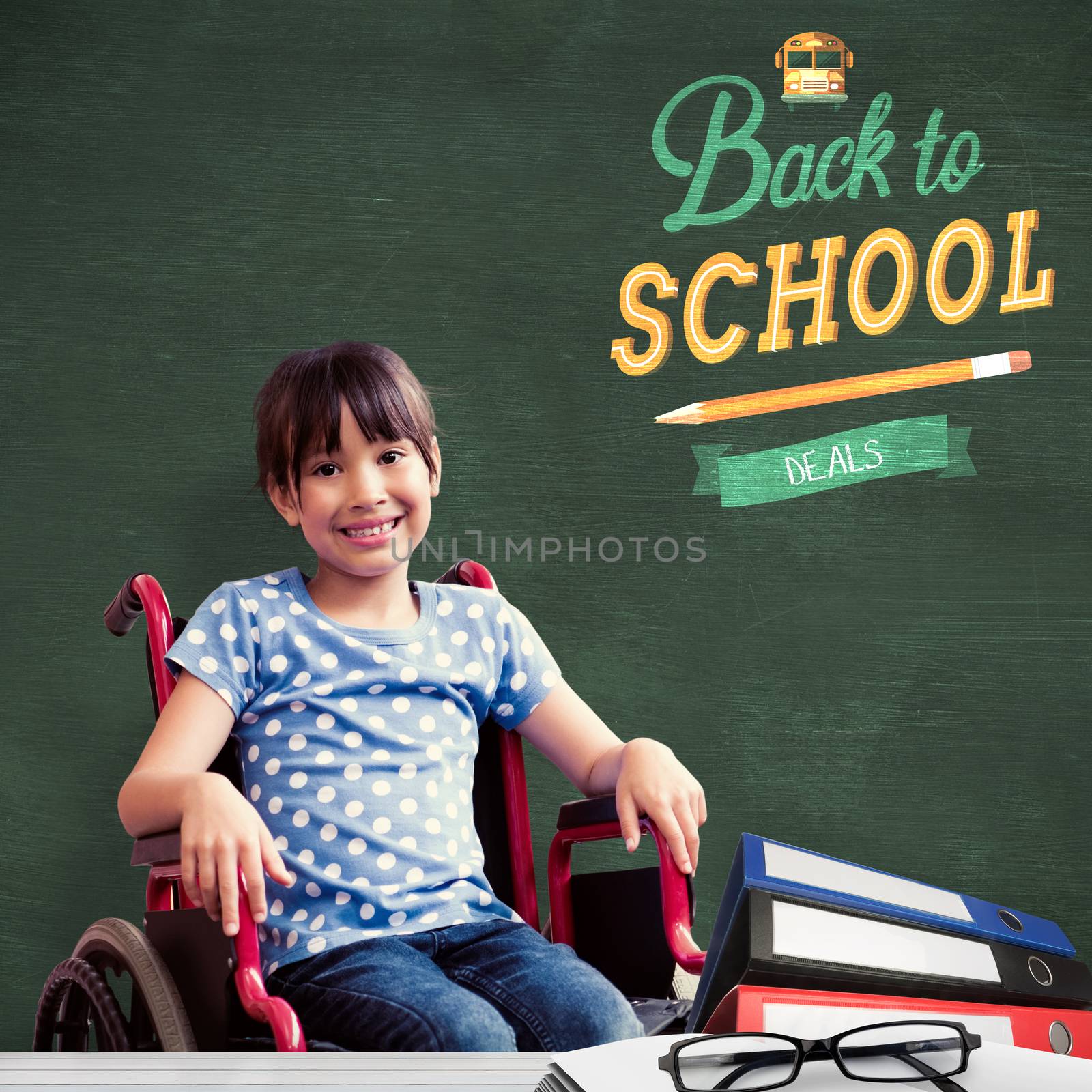 Cute disabled pupil smiling at camera in hall  against green chalkboard