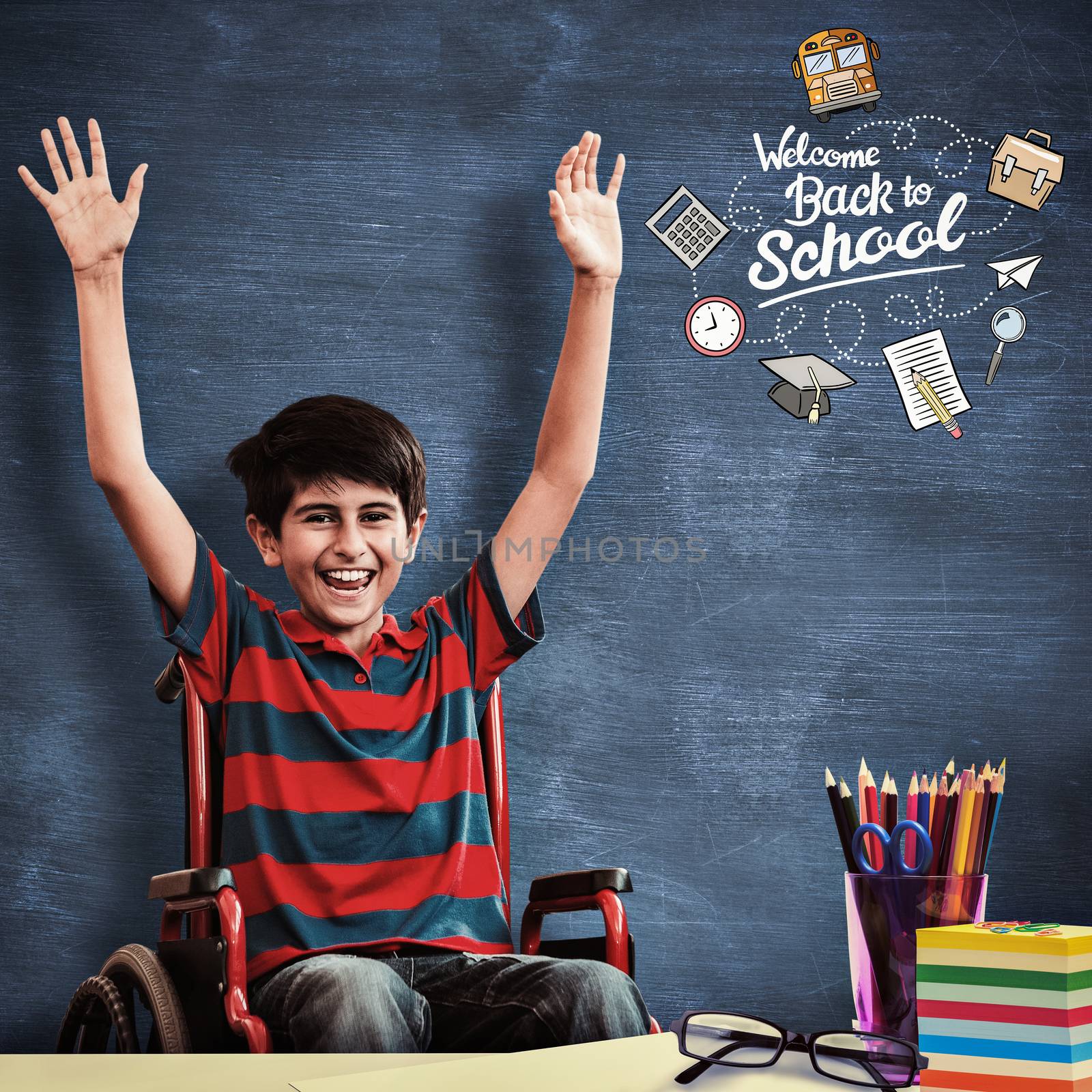 Boy in wheelchair in school corridor against blue chalkboard