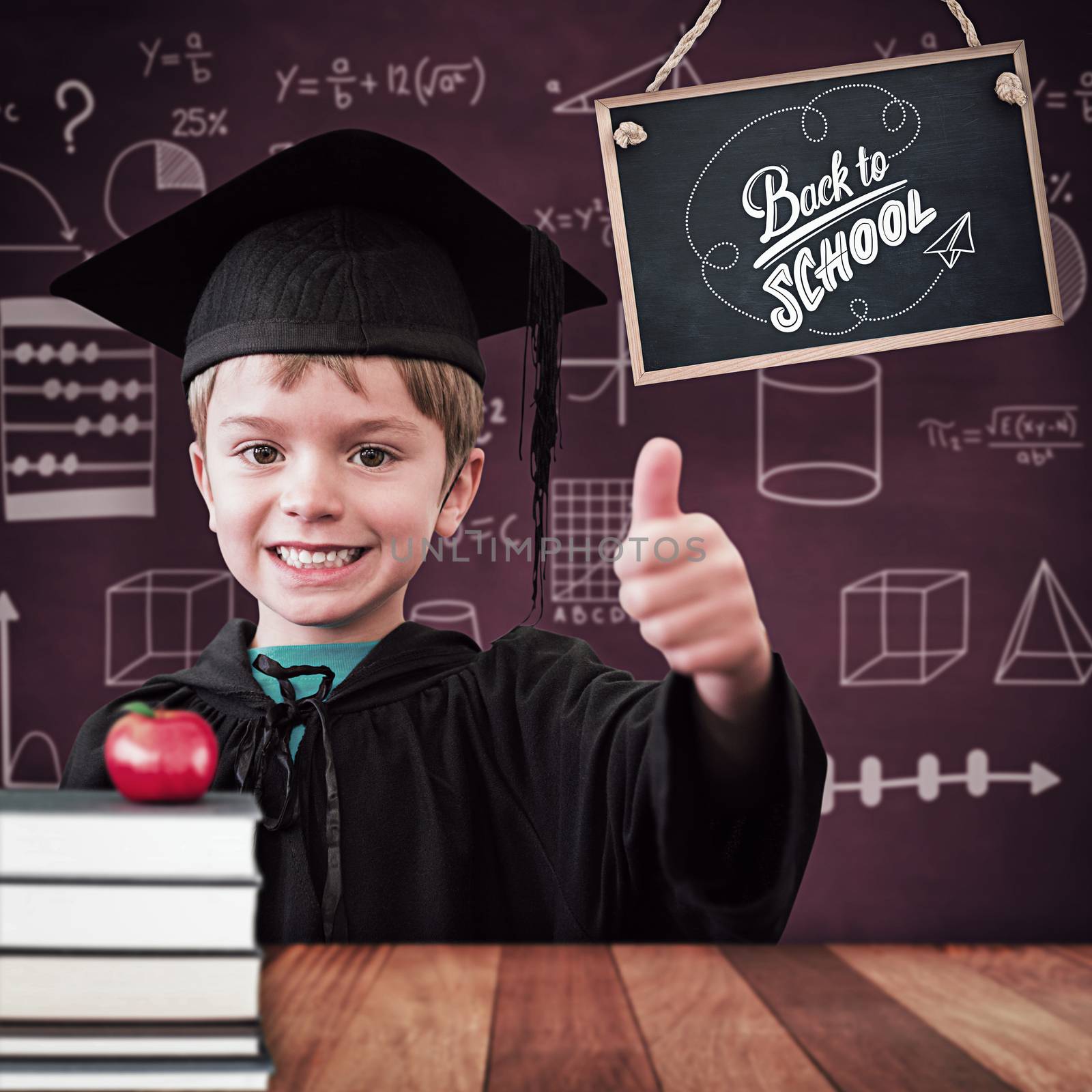 Cute pupil in graduation robe against wooden surface with planks