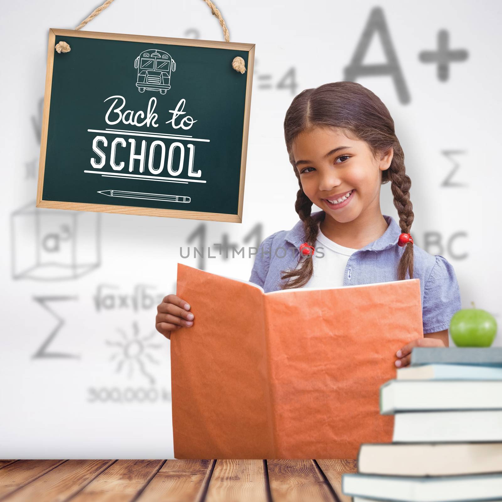 Cute pupil smiling at camera during class presentation against wooden planks background