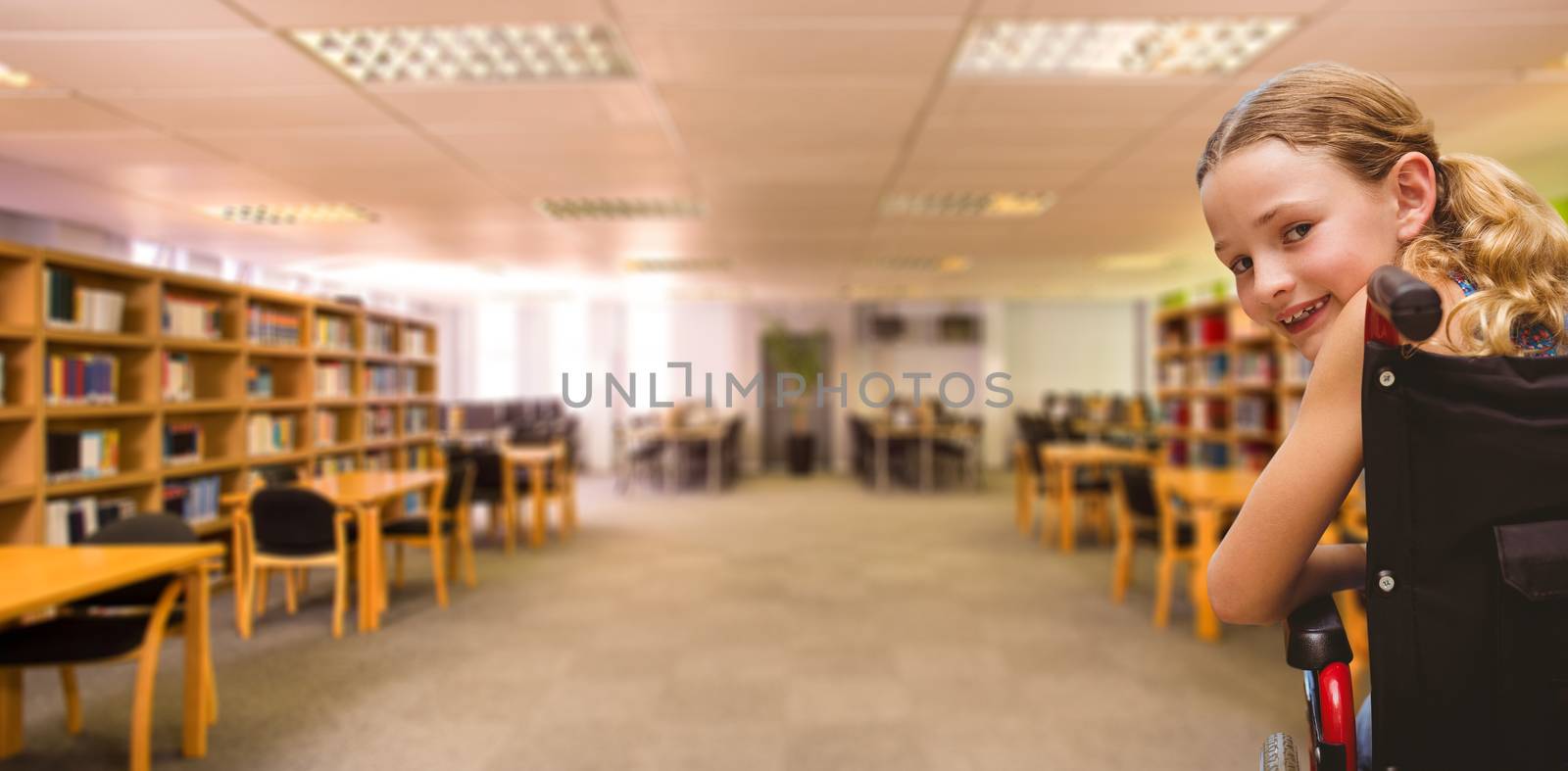 Portrait of cute girl sitting in wheelchair against view of library