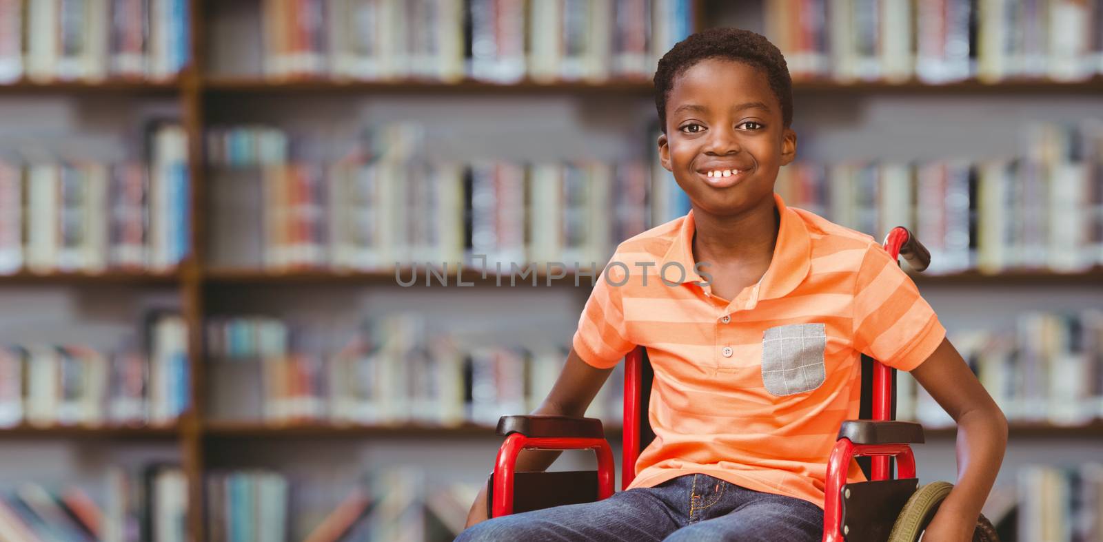 Portrait of boy sitting in wheelchair at library against library shelf