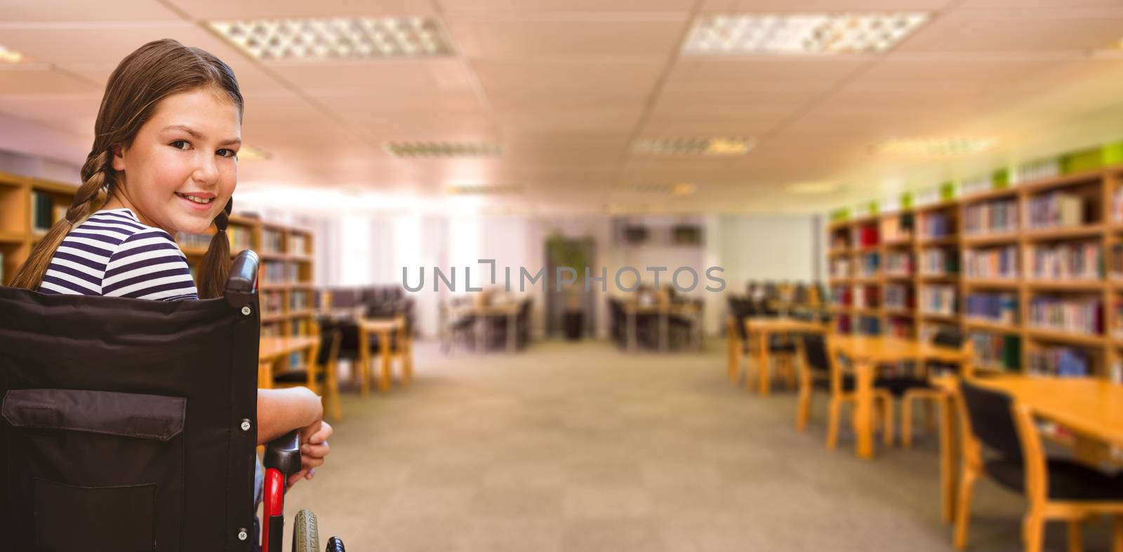 Composite image of girl sitting in wheelchair in school by Wavebreakmedia