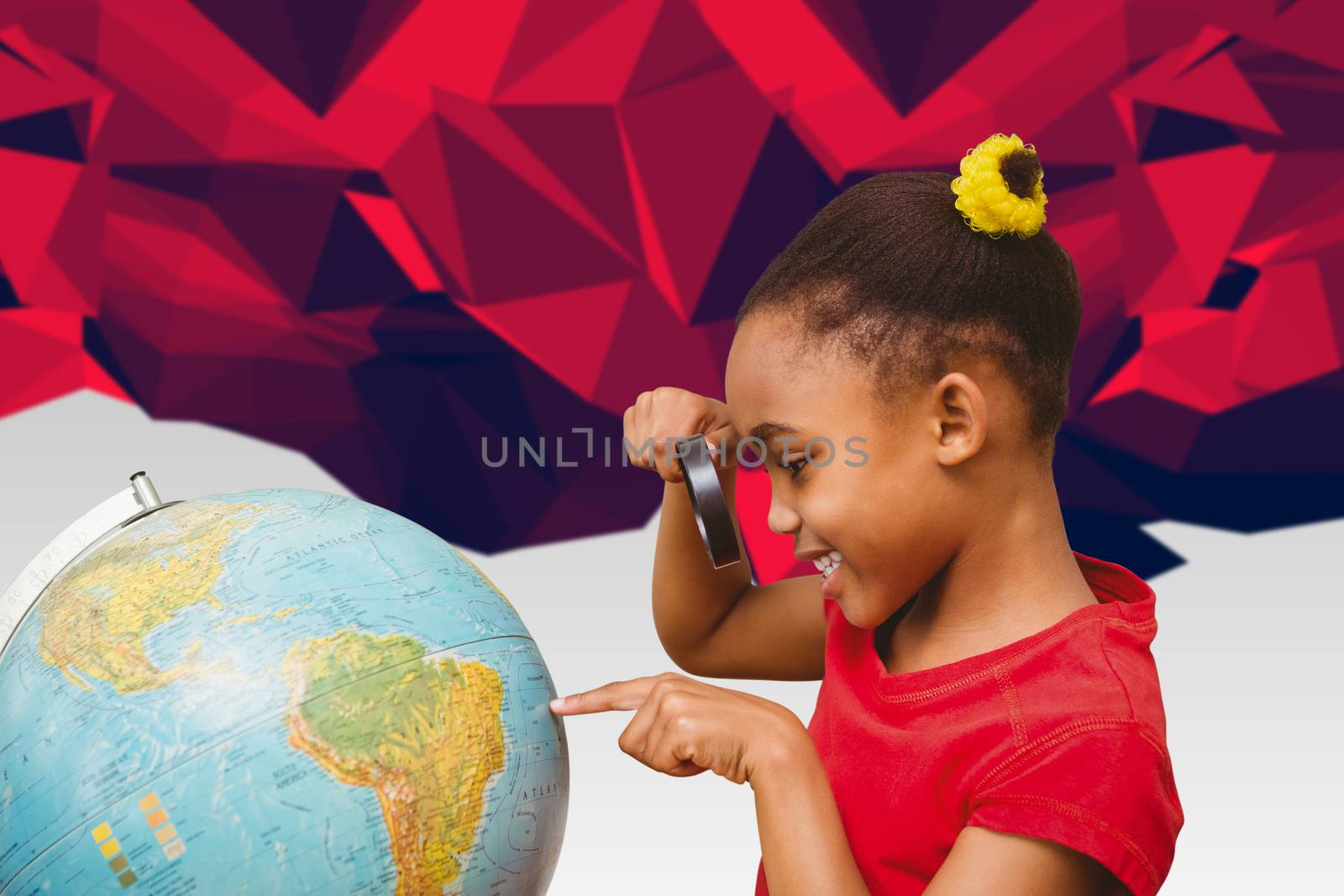 Composite image of pupil studying the globe by Wavebreakmedia