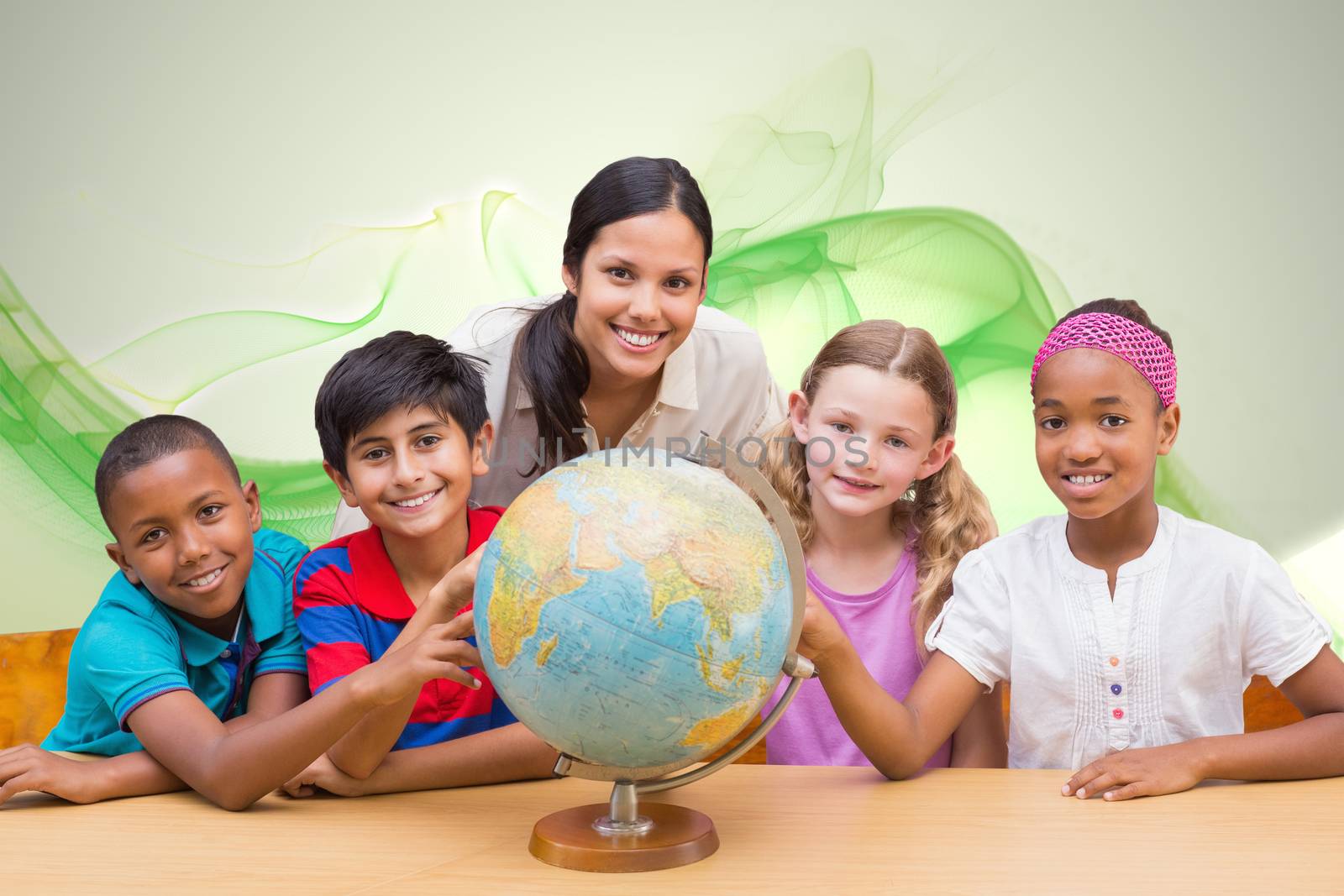 Cute pupils and teacher looking at globe in library  against green abstract design