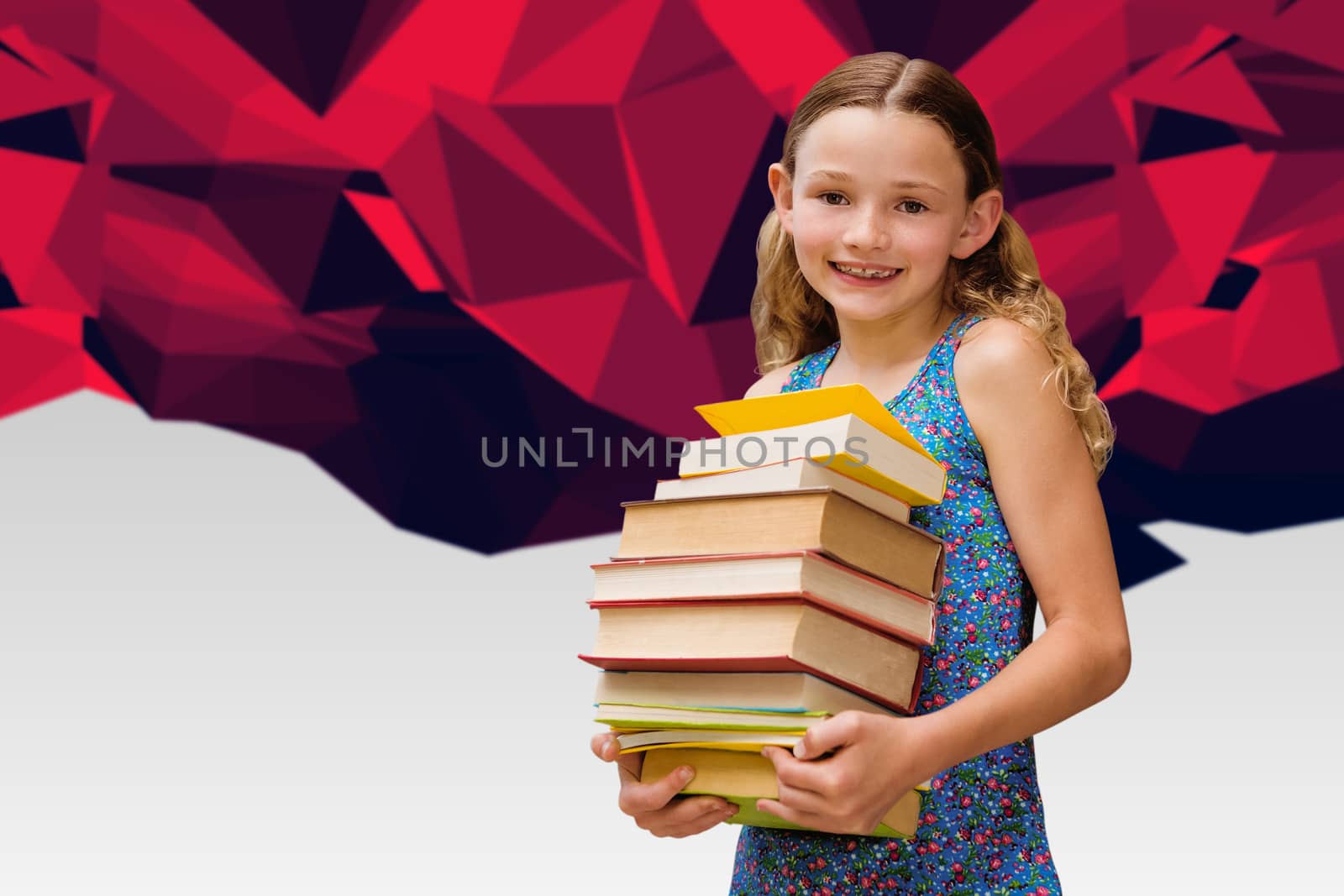 Composite image of cute little girl carrying books in library by Wavebreakmedia