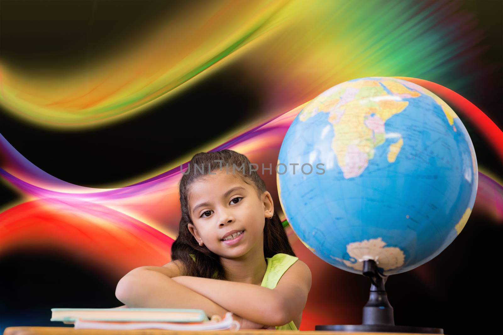 Composite image of cute pupils sitting at desk by Wavebreakmedia