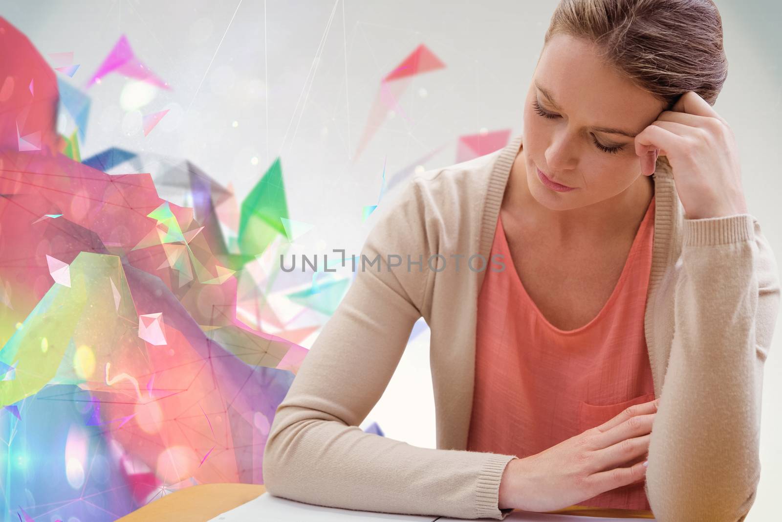 Student studying against colourful abstract design