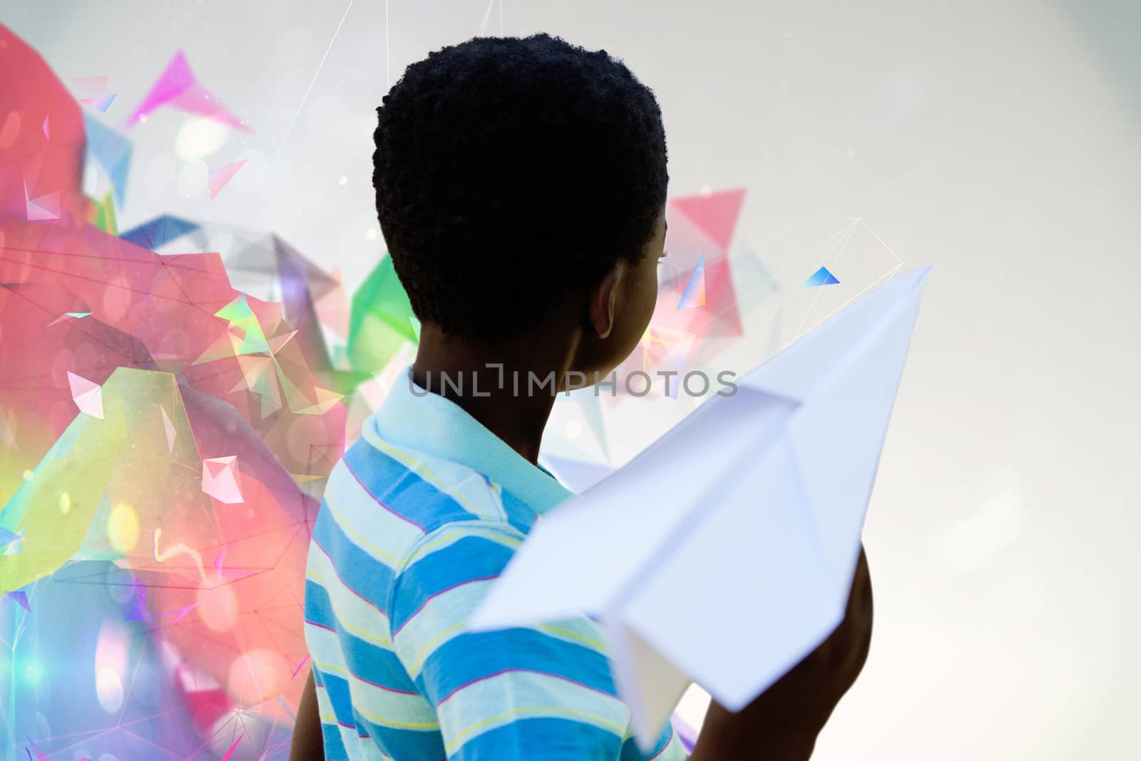 Composite image of cute little boy with paper airplane by Wavebreakmedia