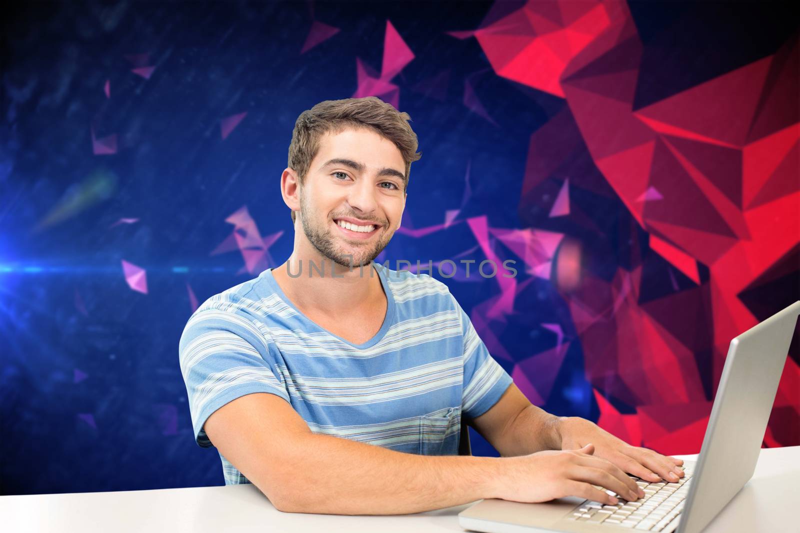 Composite image of student on laptop by Wavebreakmedia