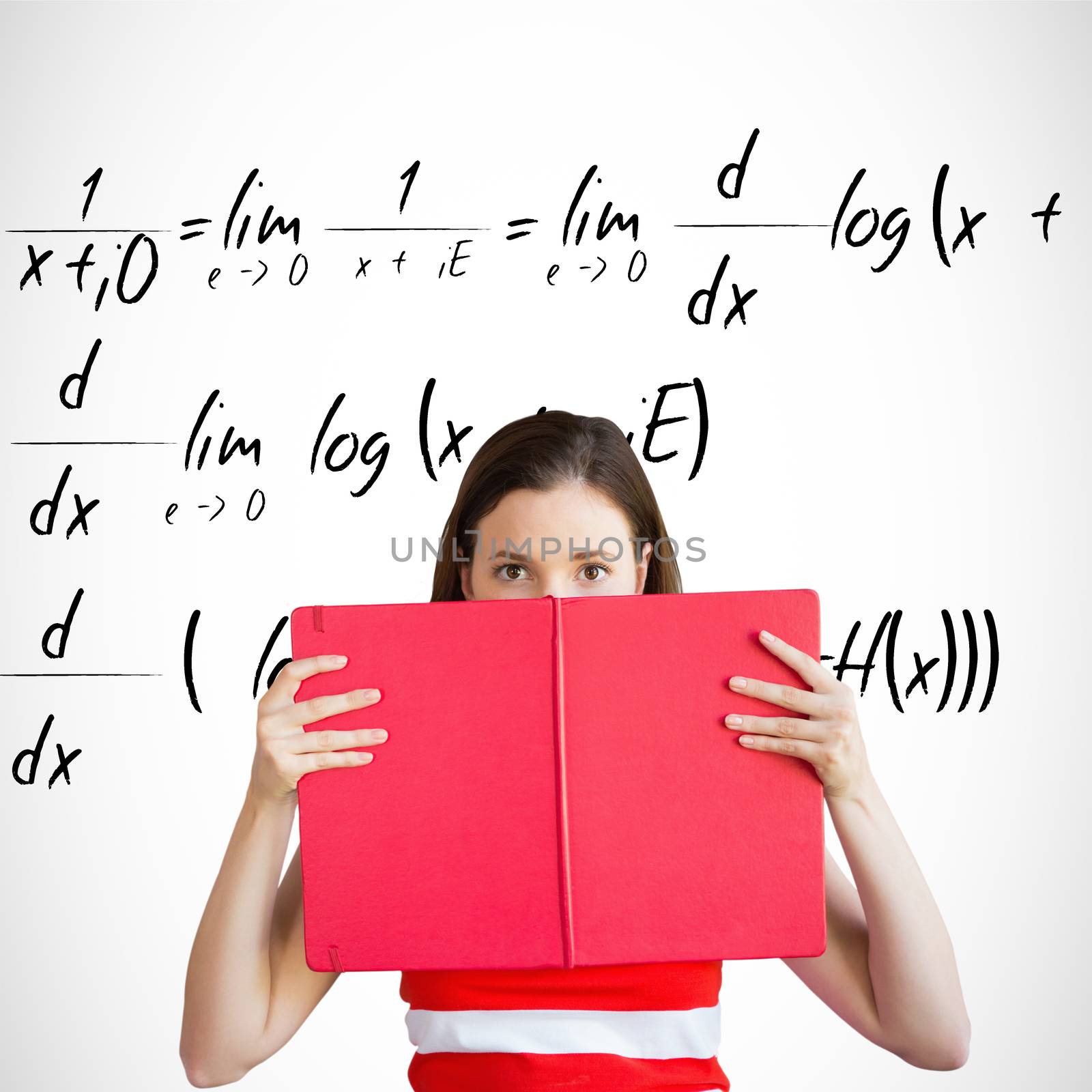 Student holding book over face against maths equation