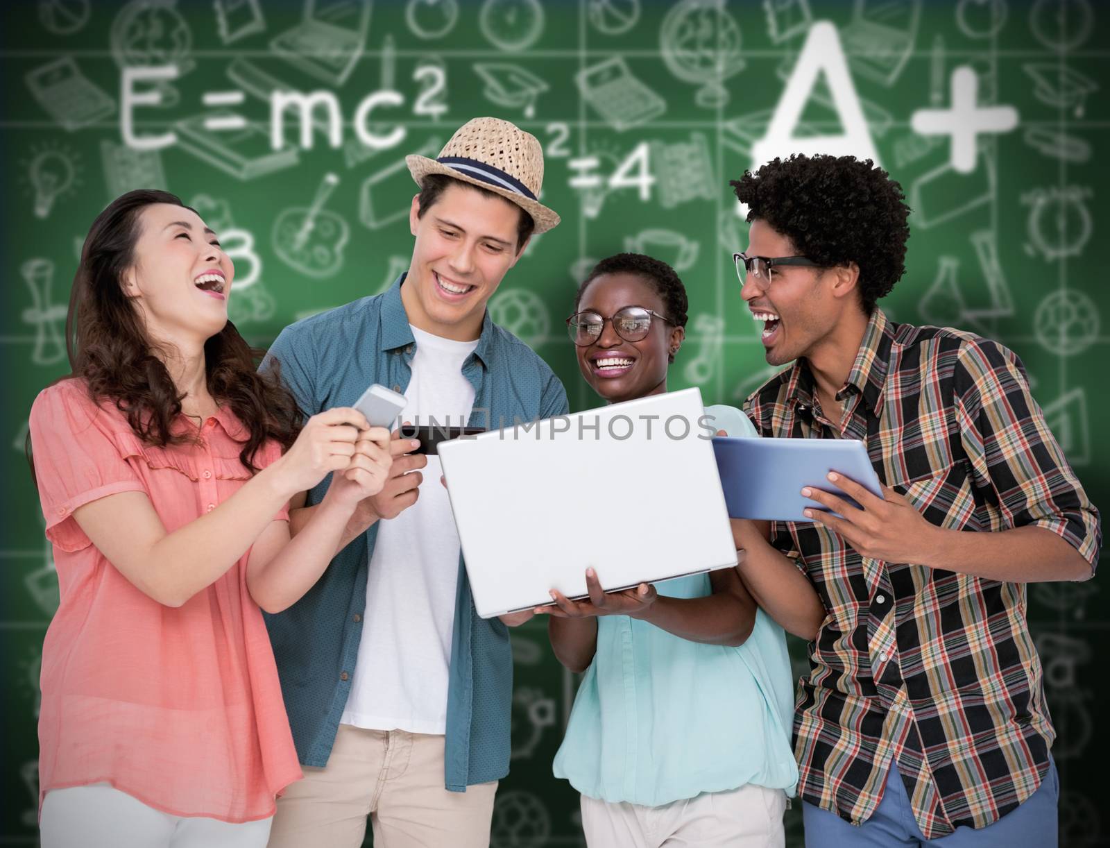 Stylish friends using their technology against green chalkboard