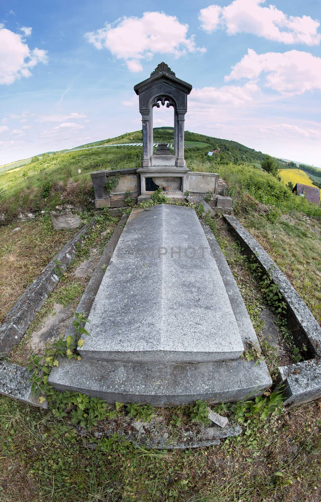 image of the old grave at an abandoned graveyard - fish-eye lens view