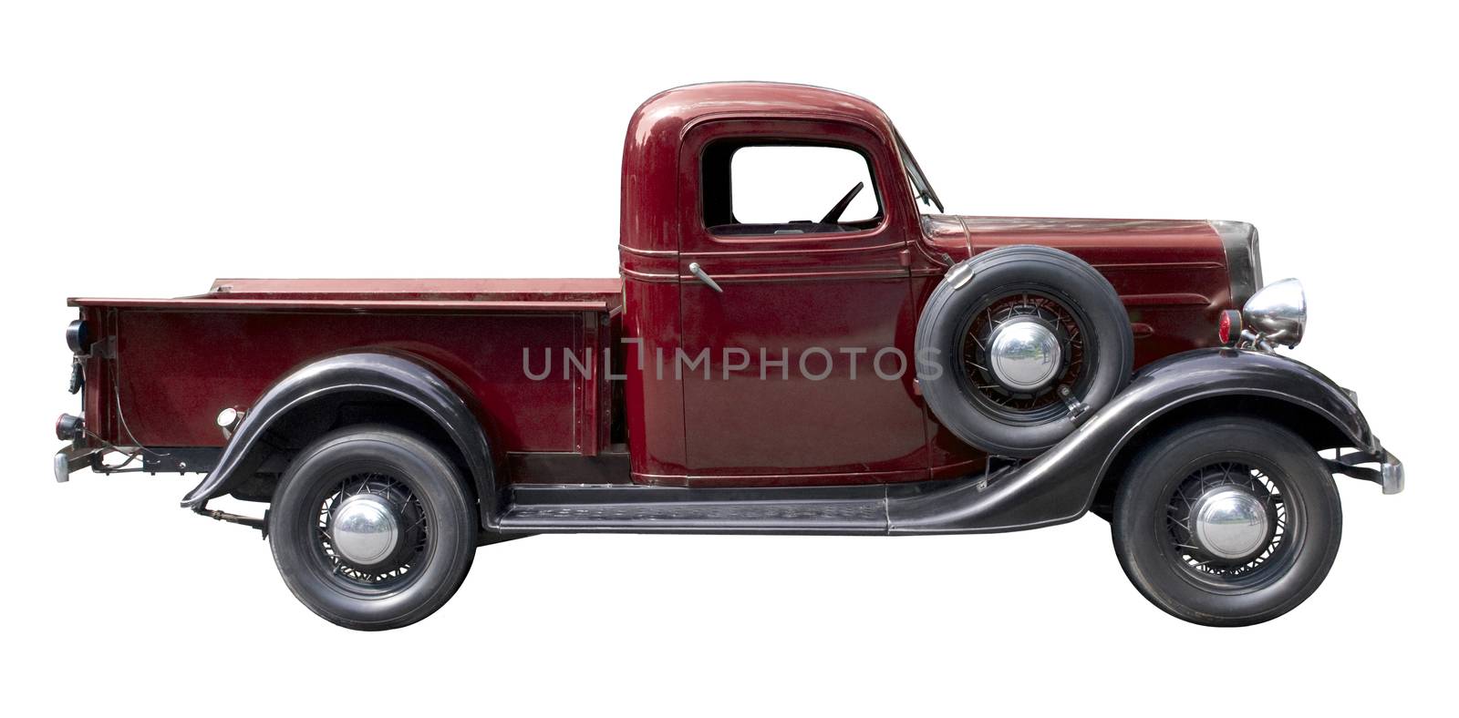 Red vintage pickup truck from 1930s isolated against white background