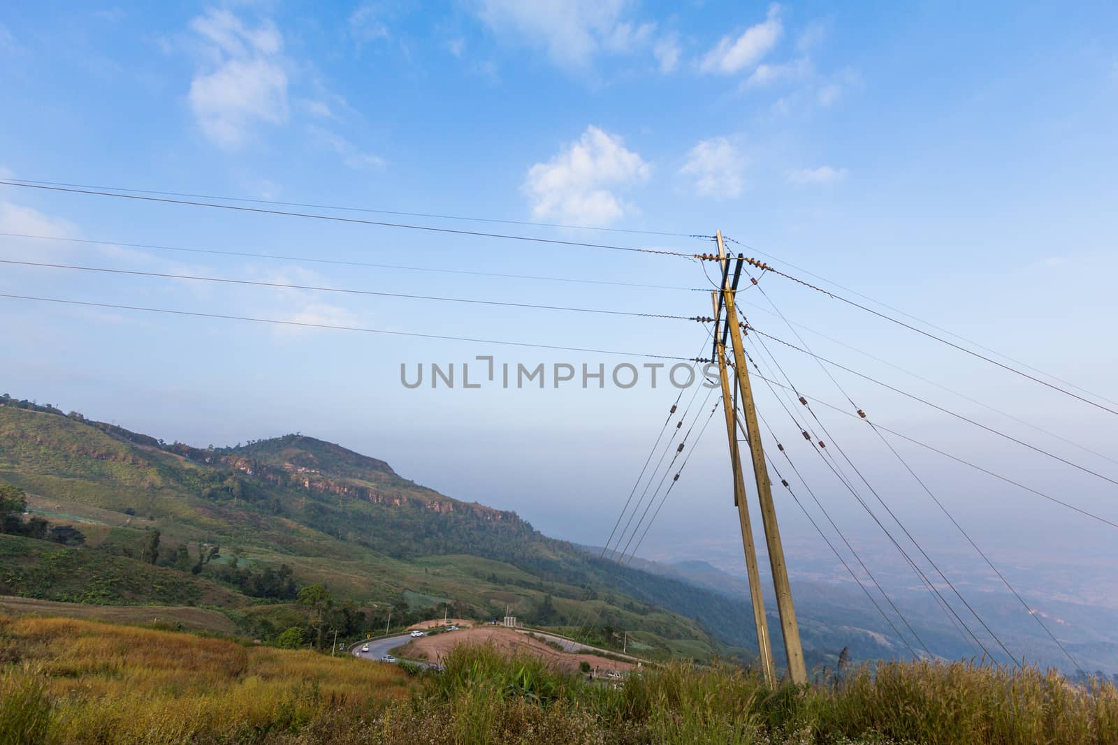 Electricity post on a mountain in Thailand by kritsada1992