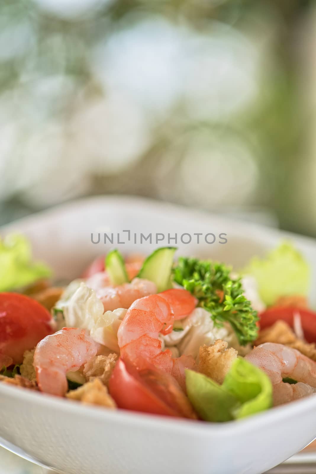 Caesar shrimp salad with cheese and arugula