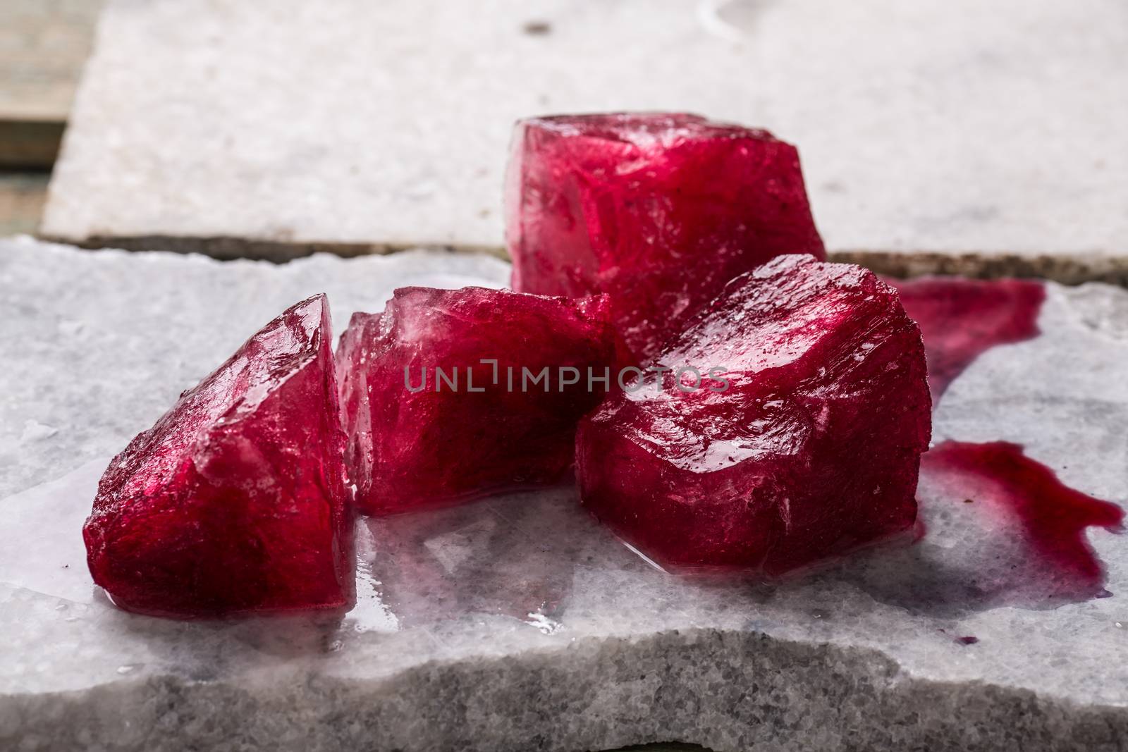 Frozen hibiscus tea also known as karkade, agua fresca or red sorrel on a marble plate
