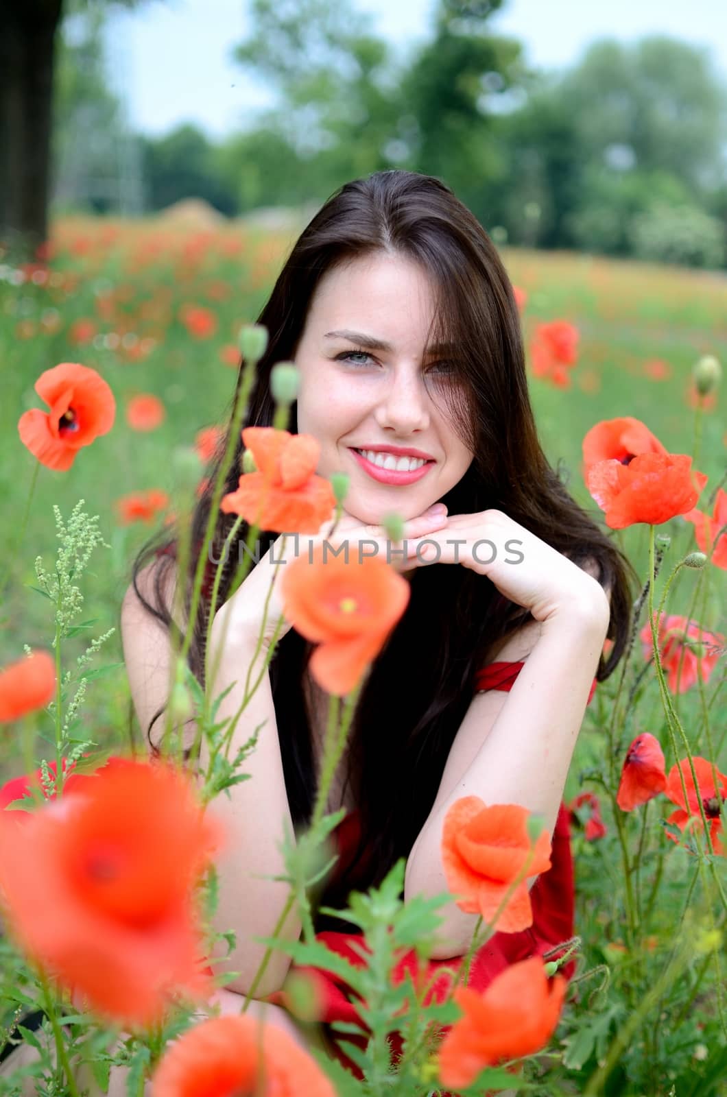Smiling girl with poppies by bartekchiny
