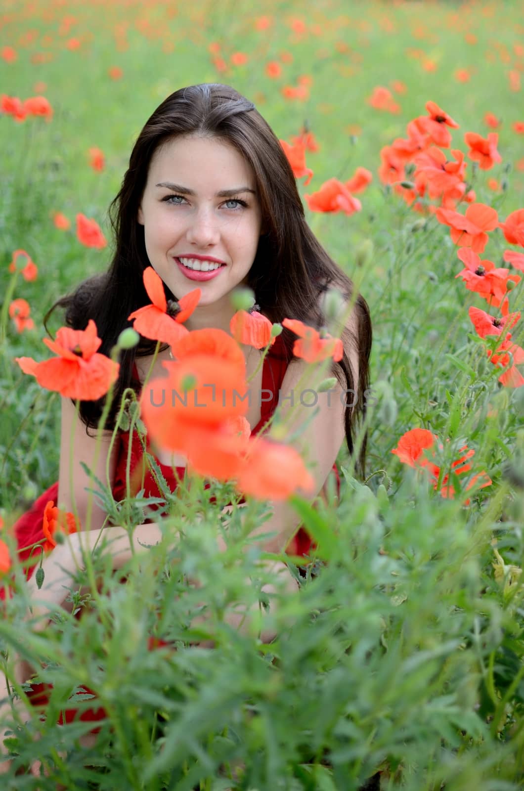 Smiling girl with poppies by bartekchiny