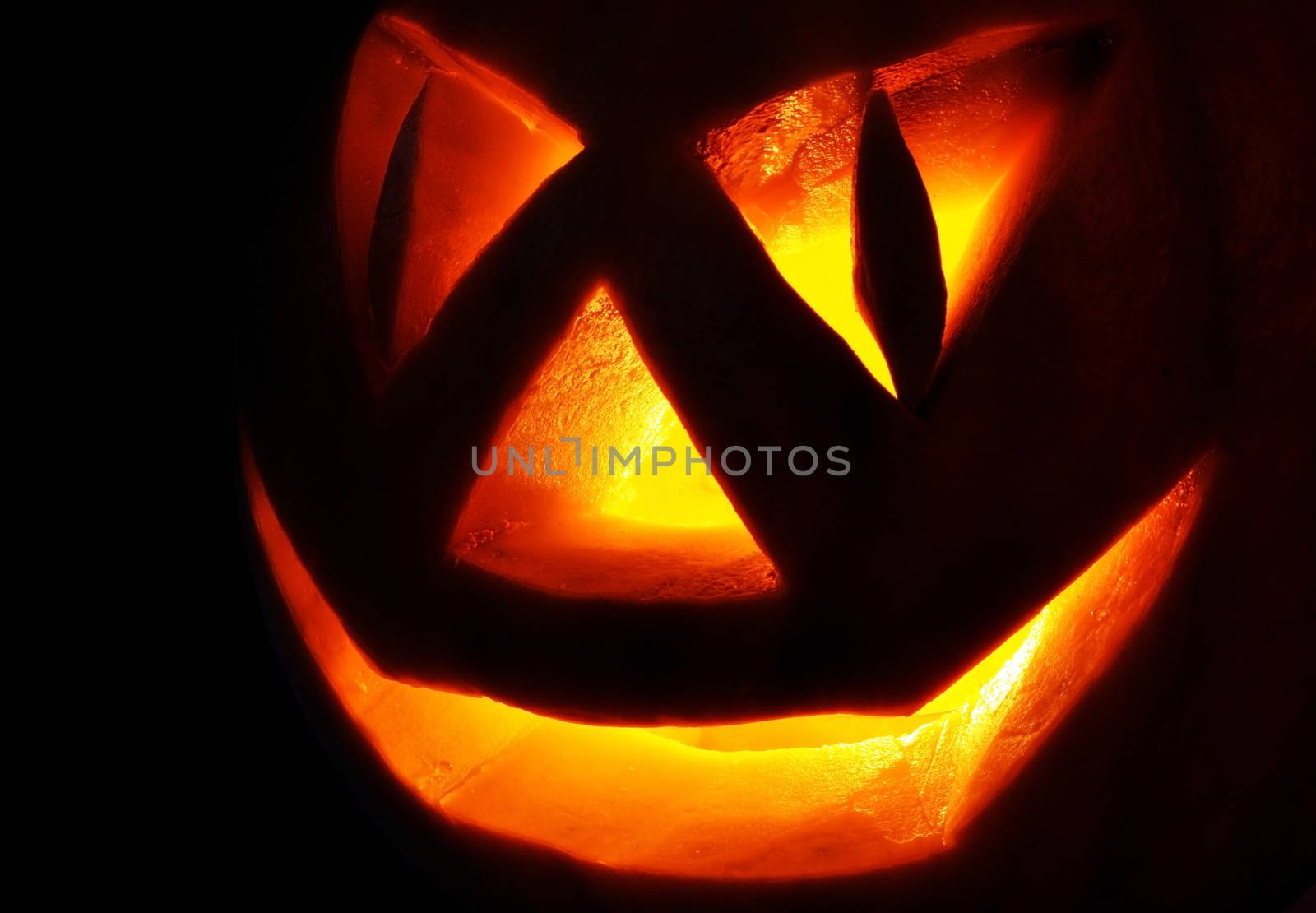 Symbol Halloween holiday, pumpkin Jack O Lantern In the dark