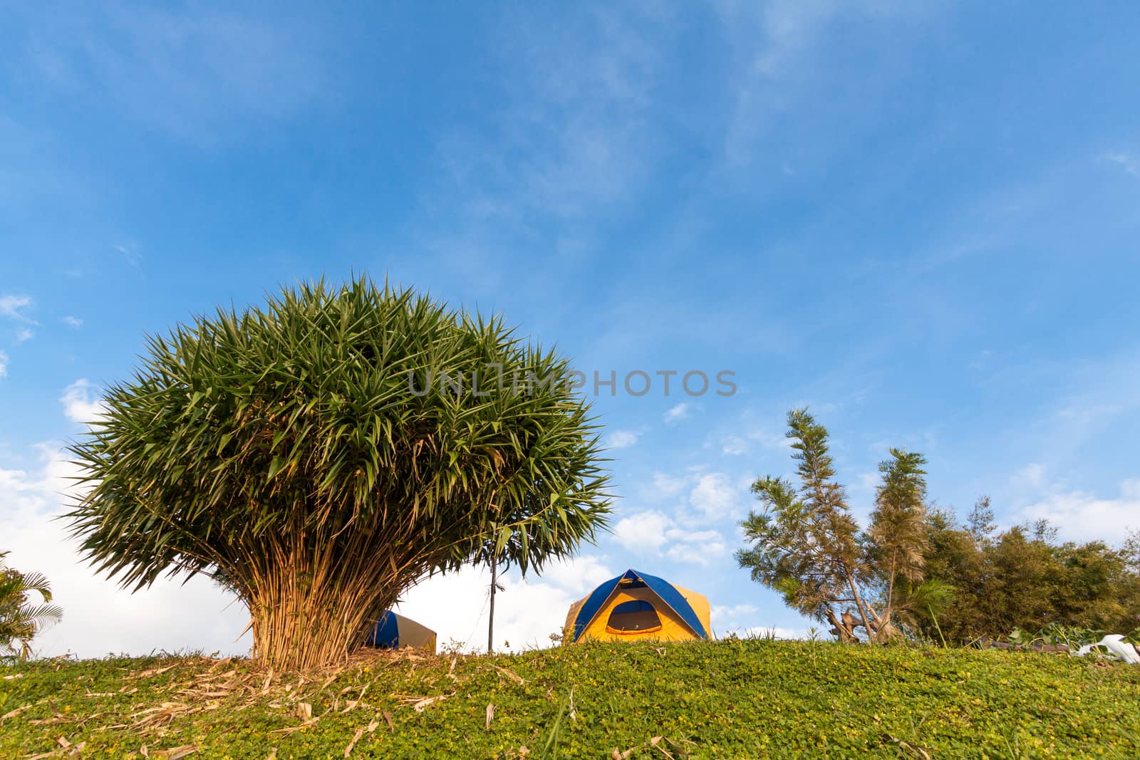 tent on mountain in bule sky