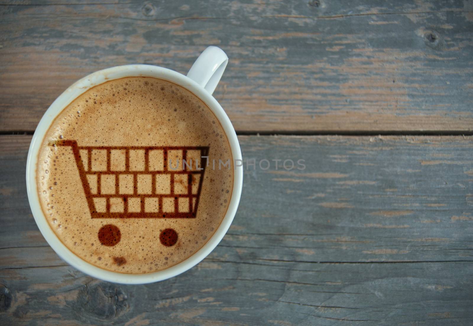 Shopping cart symbol inside a cup of coffee with space