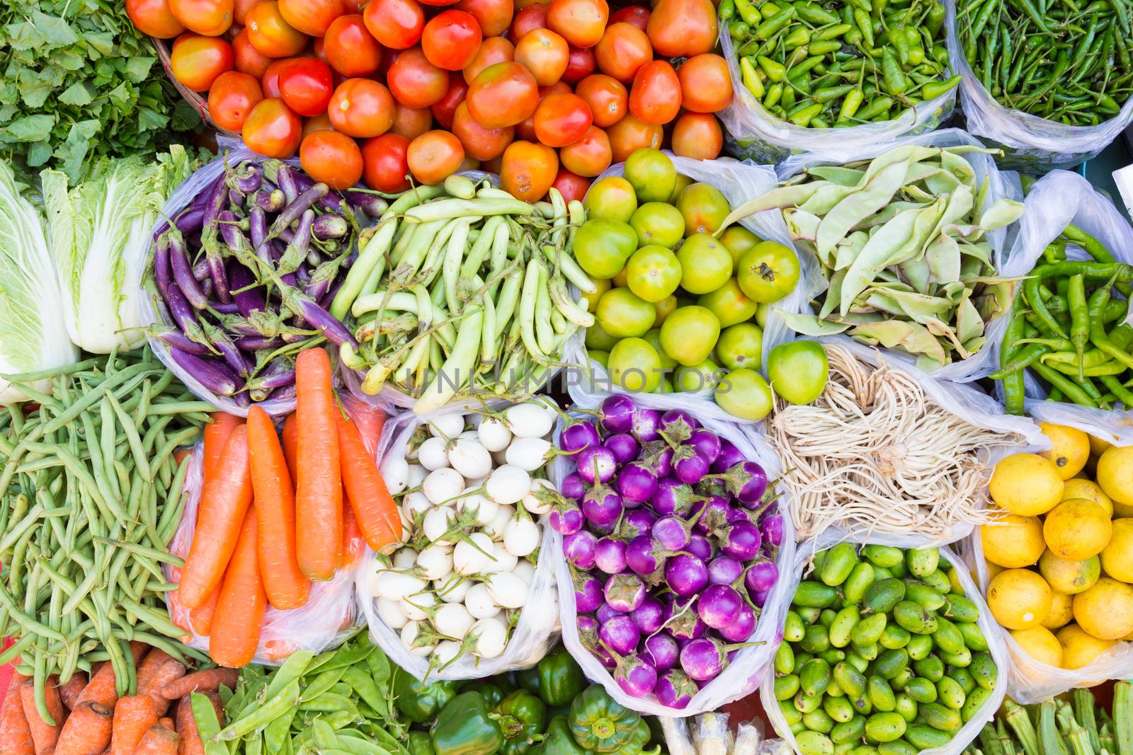 Farmers market with various domestic colorful fresh fruits and vegetable. Tasty colorful mix.