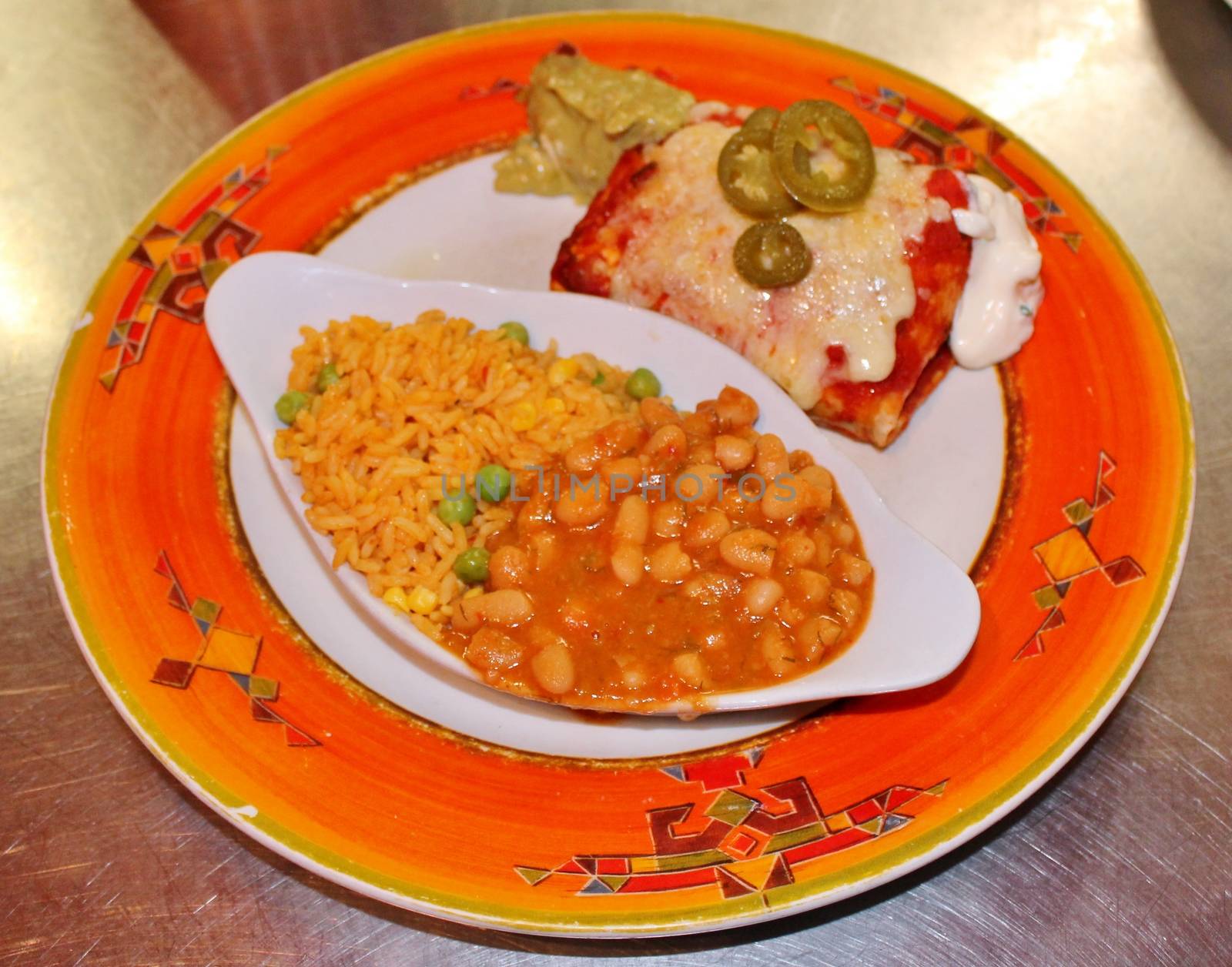 Southwest beef enchilada with sourcream and black beans.