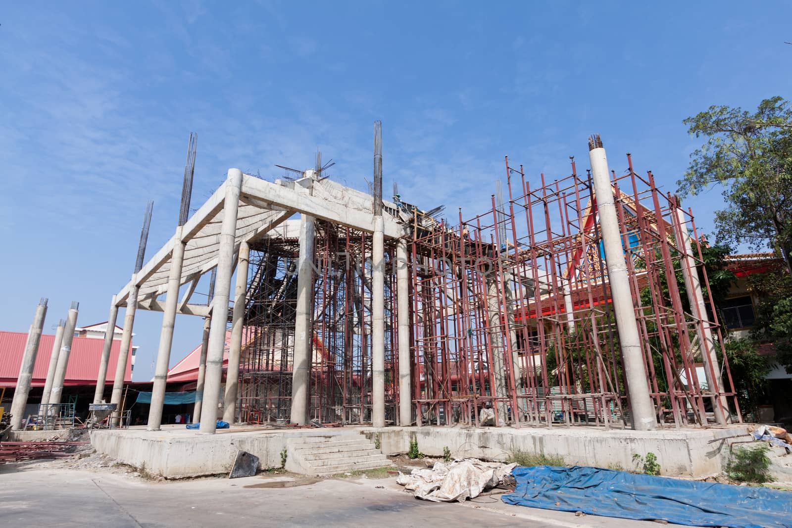 Construction site with crane and building temple