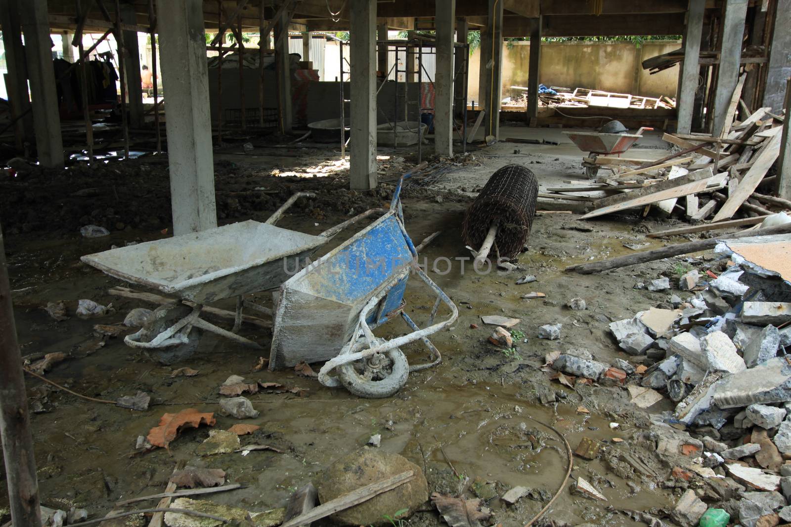 Builders wheel barrow in site by kritsada1992