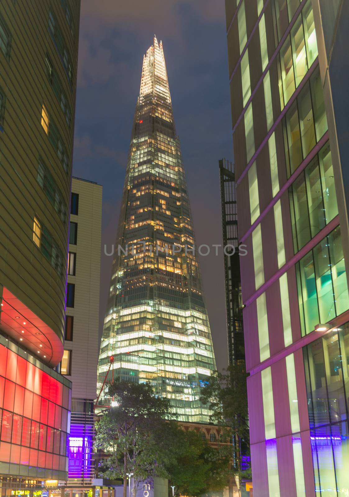 LONDON - JUNE 11: Overview of London with the Shard of Glass between buildings on June 11, 2015 in London, UK. Standing 306 metres high, the Shard is currently the tallest building in the European Union