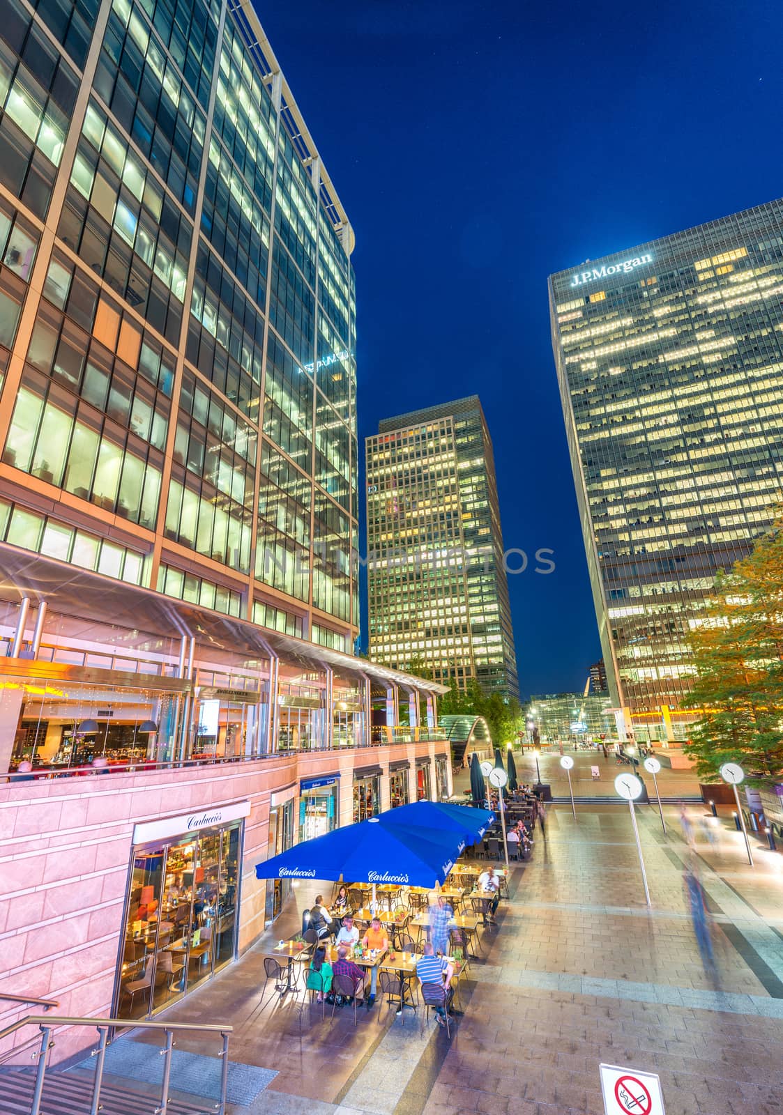 LONDON - JUNE 15, 2015: Canary Wharf at night. Canary Wharf with its tall buildings is the main financial district in the city of London.