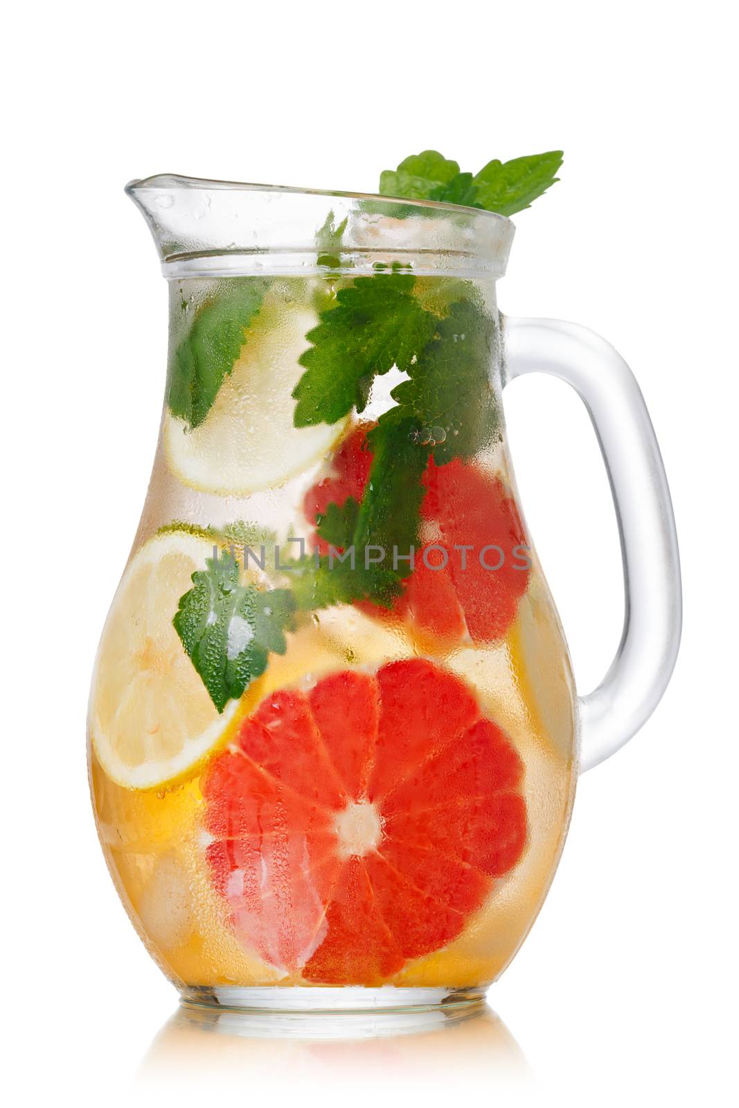 Jug of lemonade with lemon balm and grapefruit