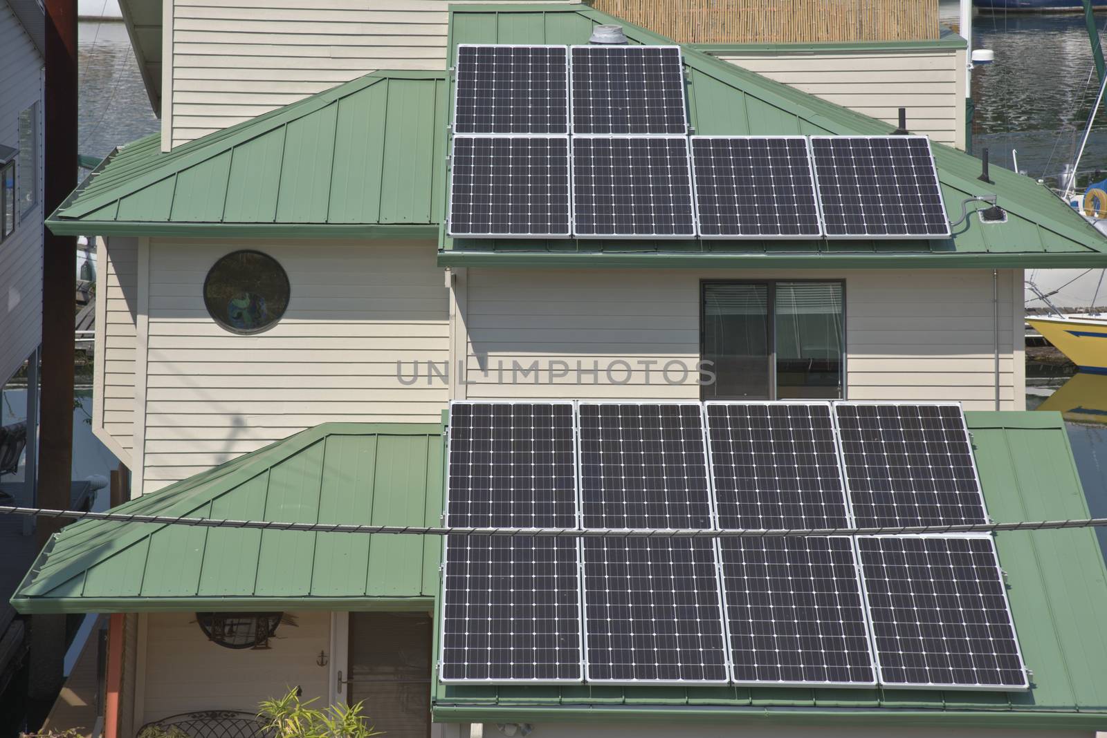 Solar panels on rooftops on a floating house Portland Oregon.