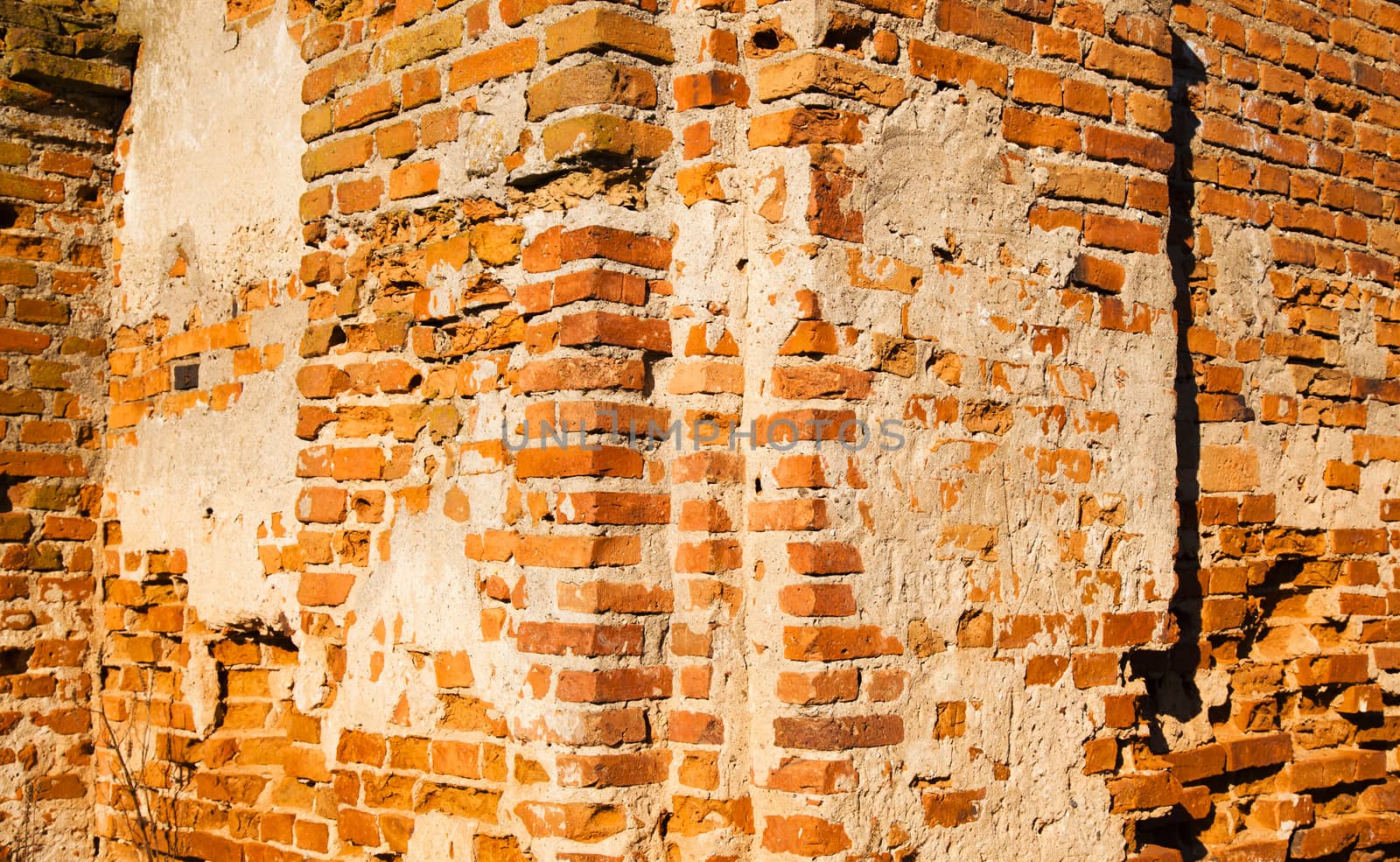   the old brick wall collapsing eventually