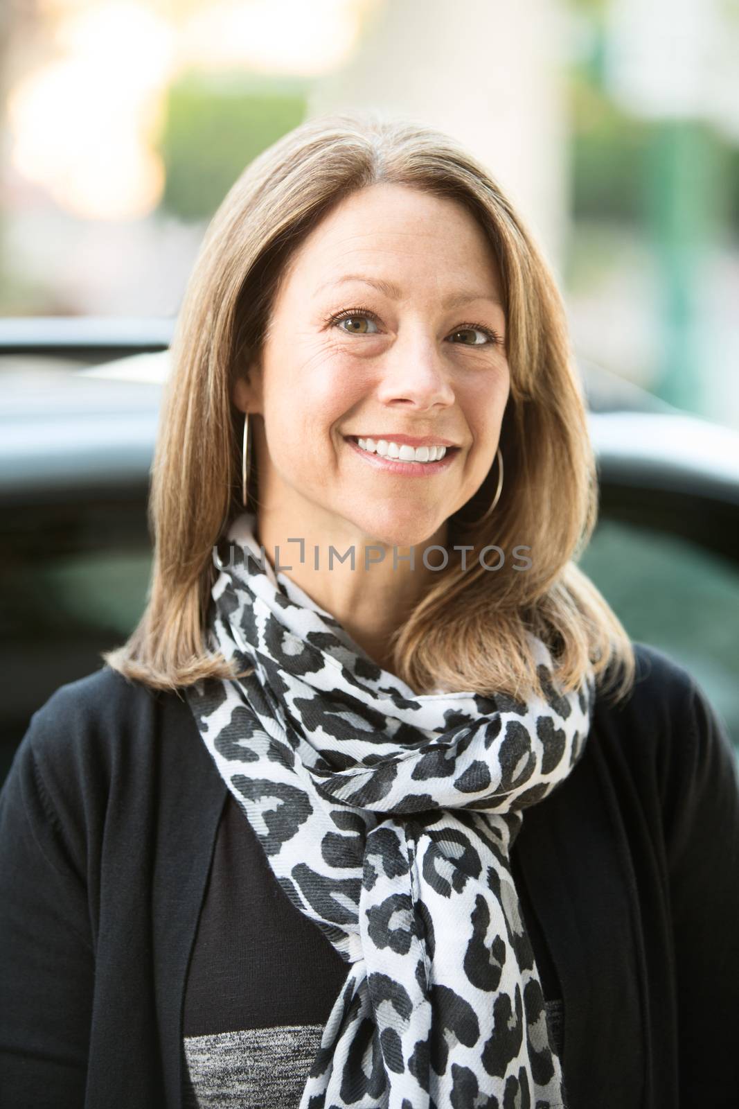 Beautiful Caucasian adult business woman close up outdoors