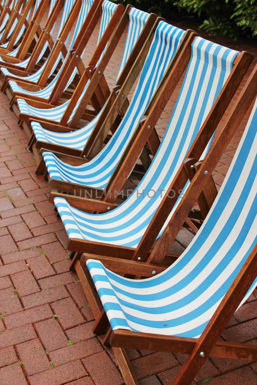 row of striped deck chairs by cheekylorns