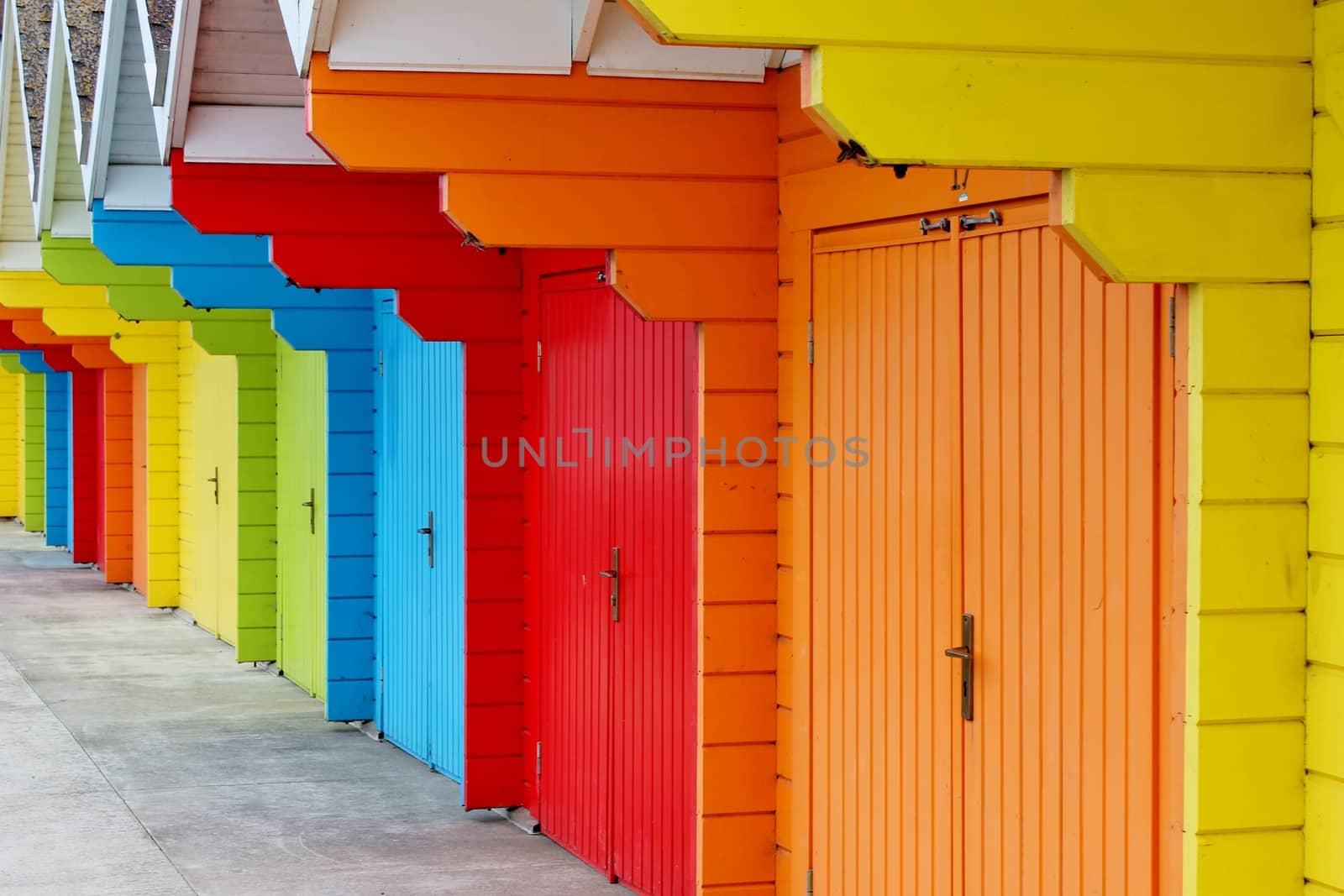 colourful paint wooden Victorian beach hut at the seaside