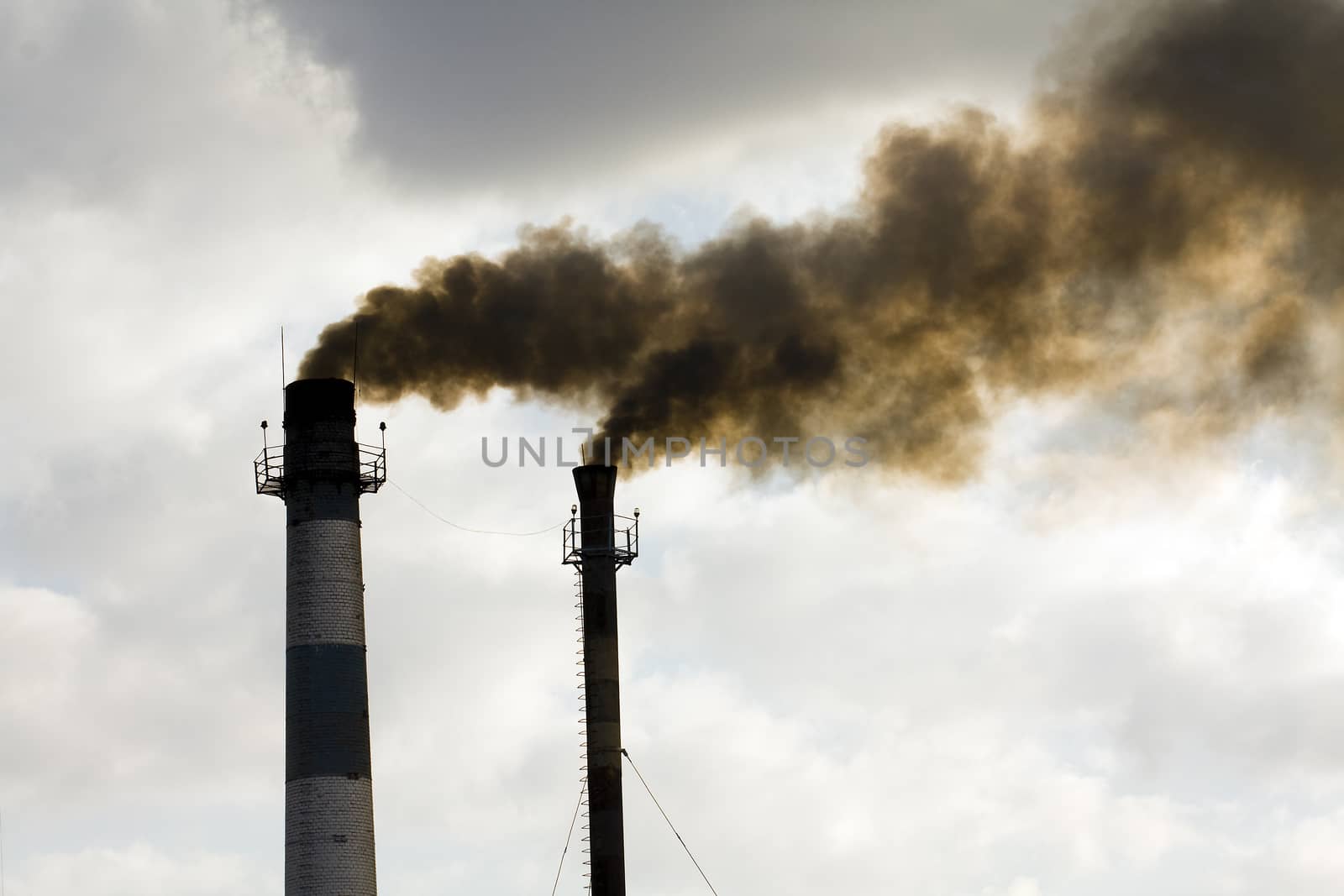 pipes, of which comes out black smoke
