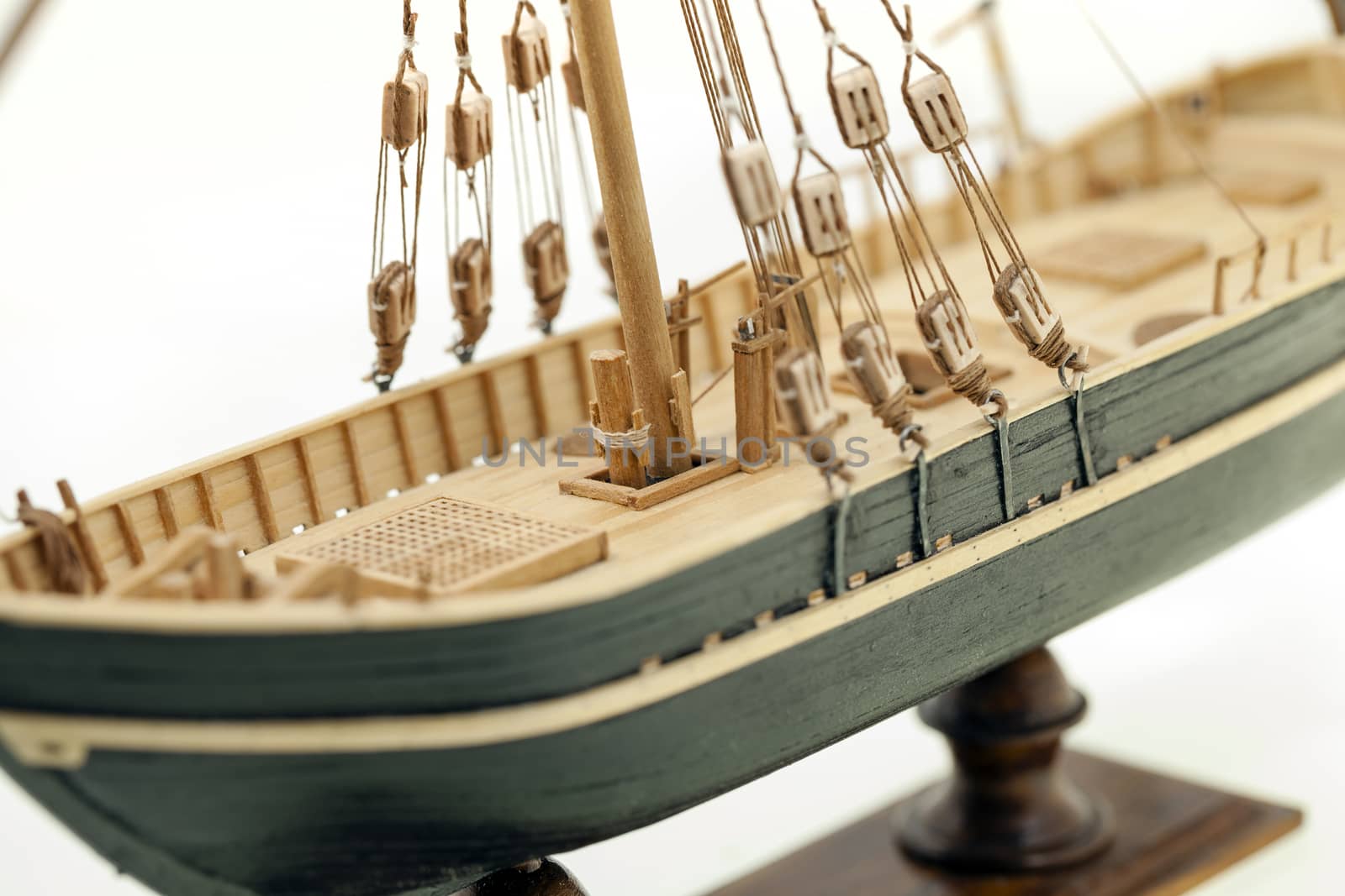   the part of model of the ship made of a tree. photographed by a close up