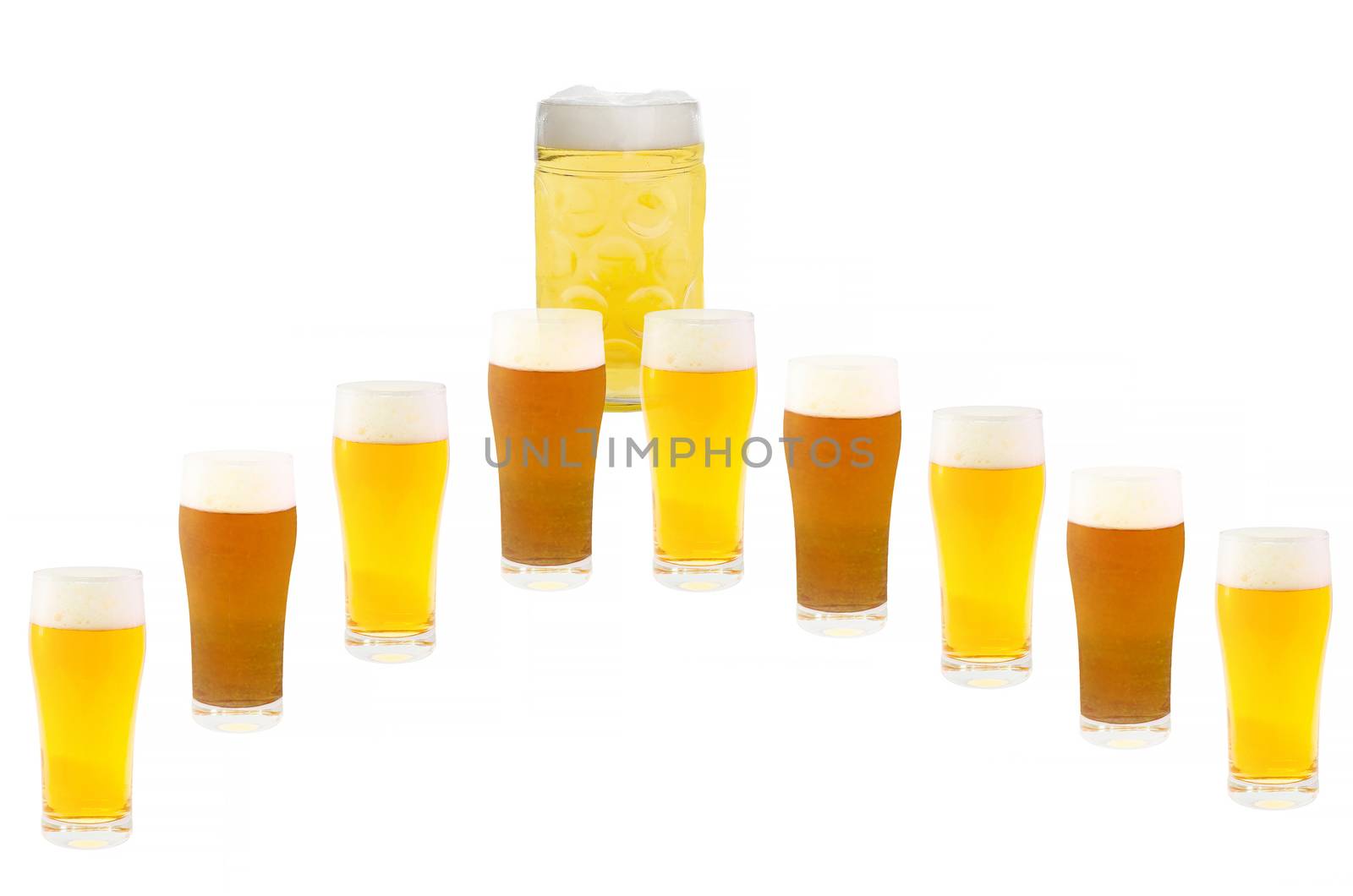 Several beer glasses in a row. Light and dark beer. In the background, a large beer mug.