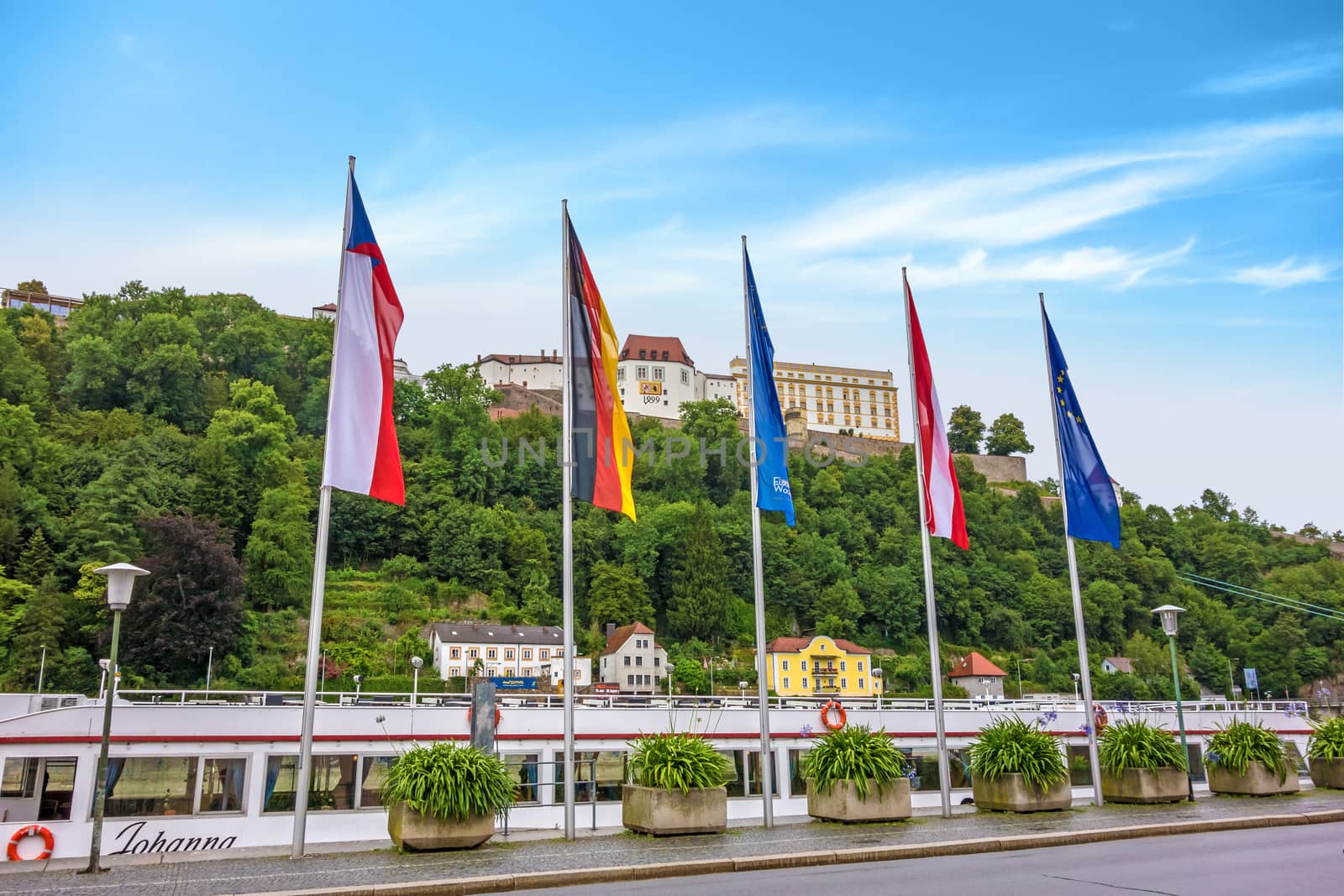 Passau, Germany - June 29, 2014: Veste Oberhaus, historical stronghold of the old historical city of Passau, a famous tourist spot - view from town hall near the river Donau