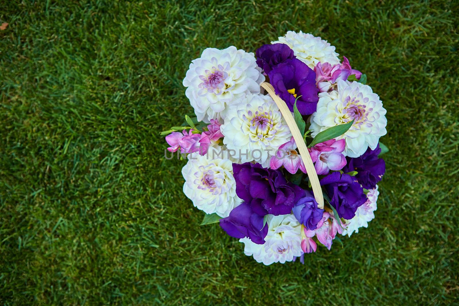 bouquet of flowers on the green grass with copy paste