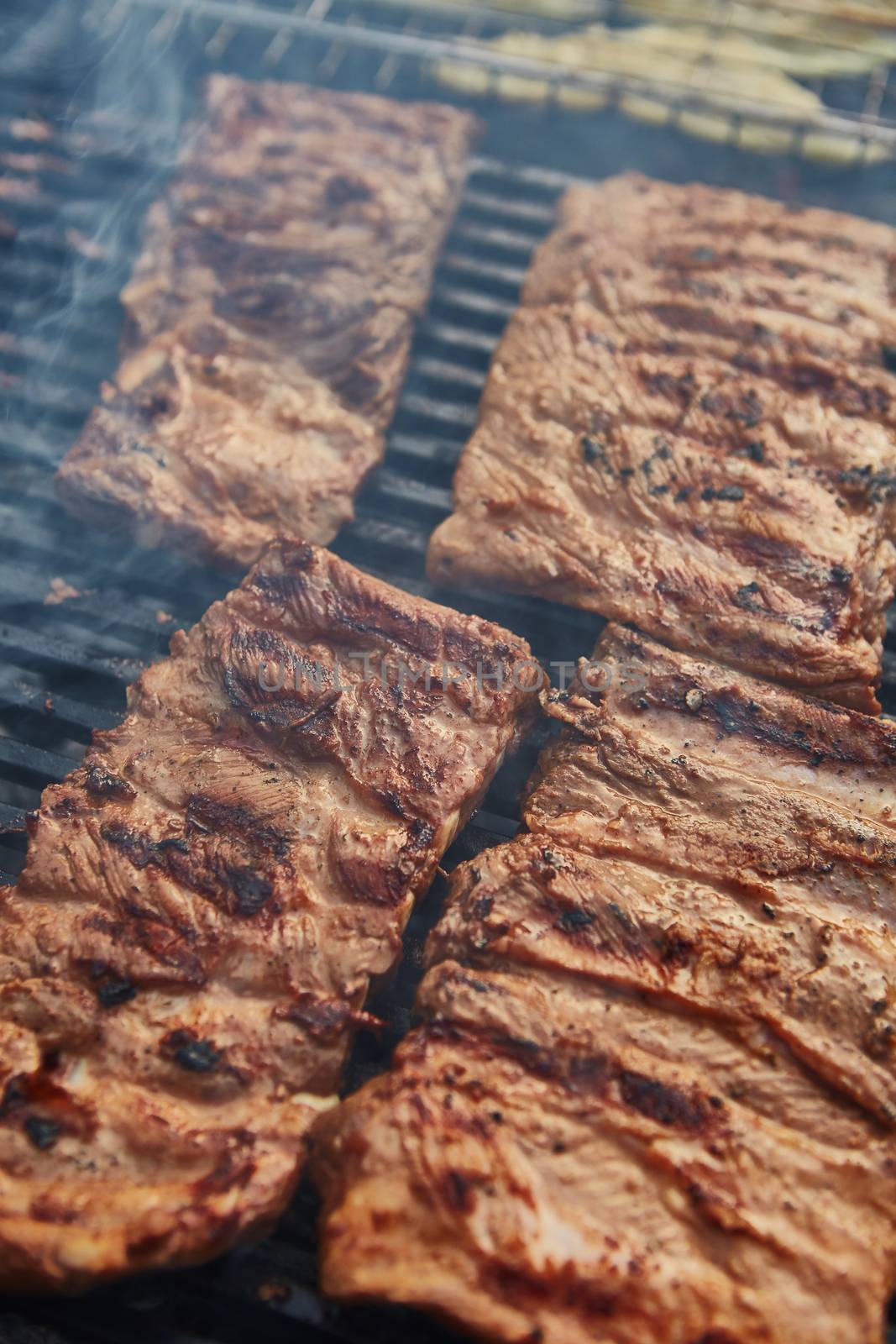 Grilled pork ribs on the grill. by sarymsakov