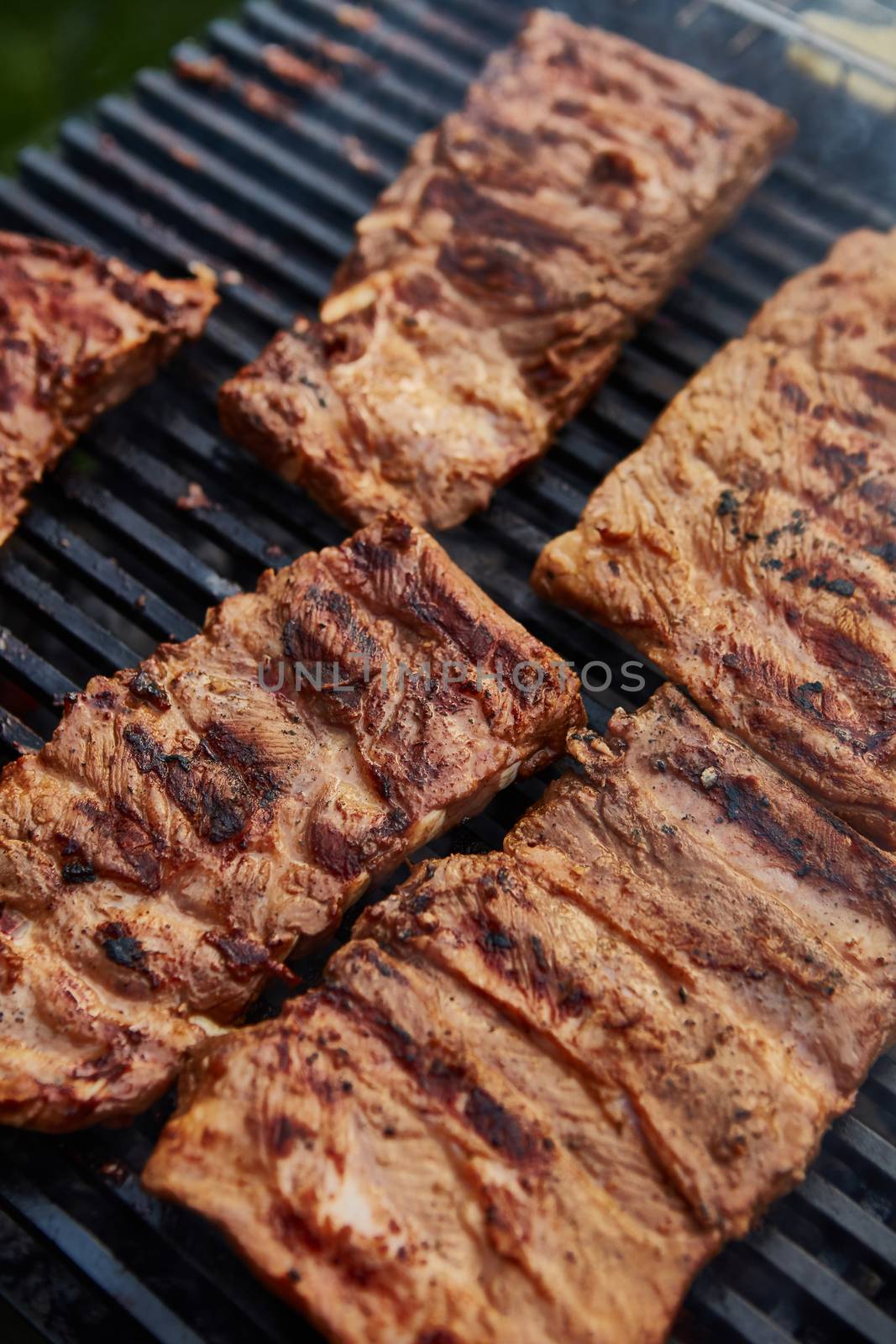 Grilled pork ribs on the grill. Shallow dof