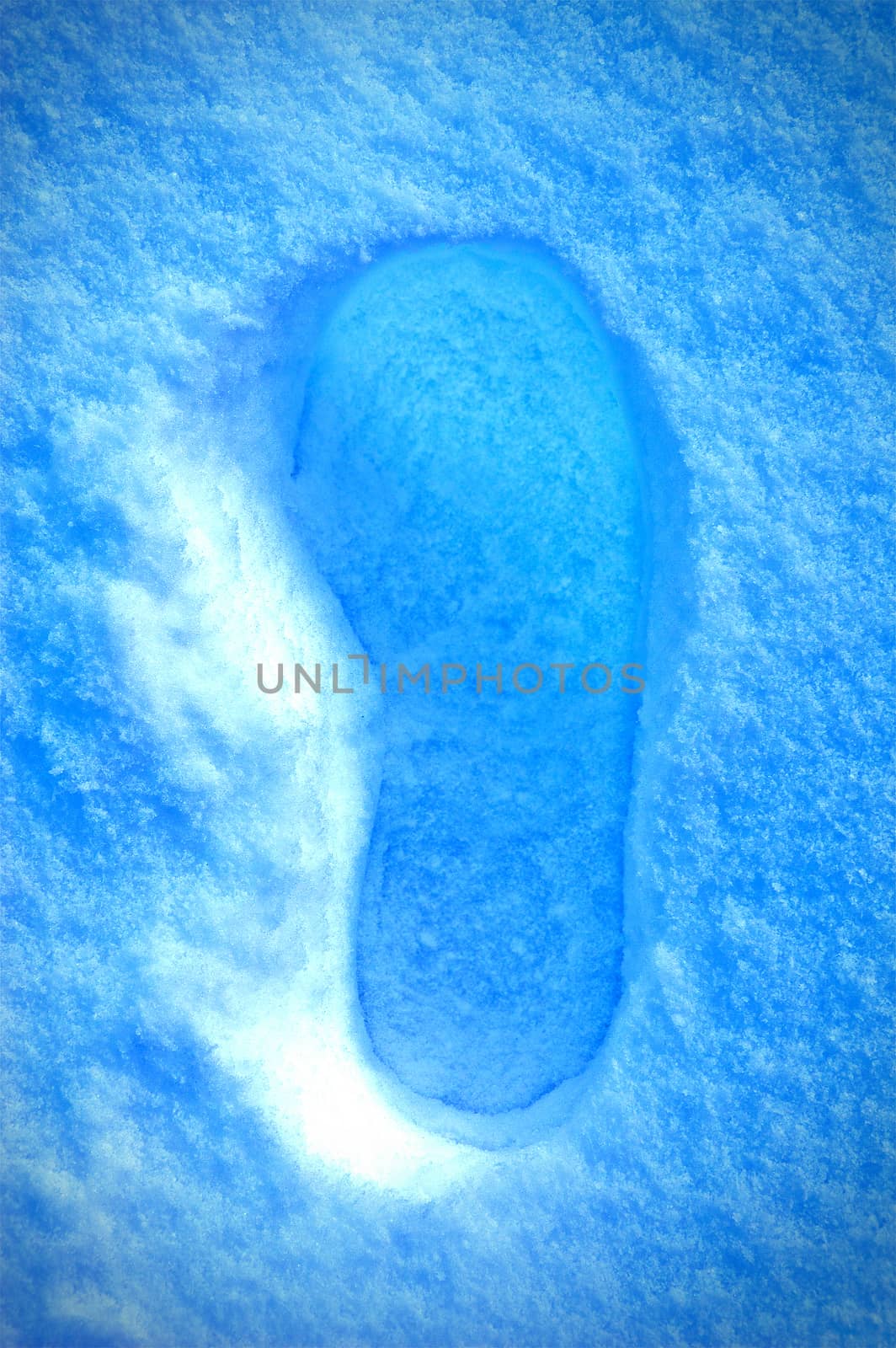 Winter background conceptual image. Footstep on the snow. 