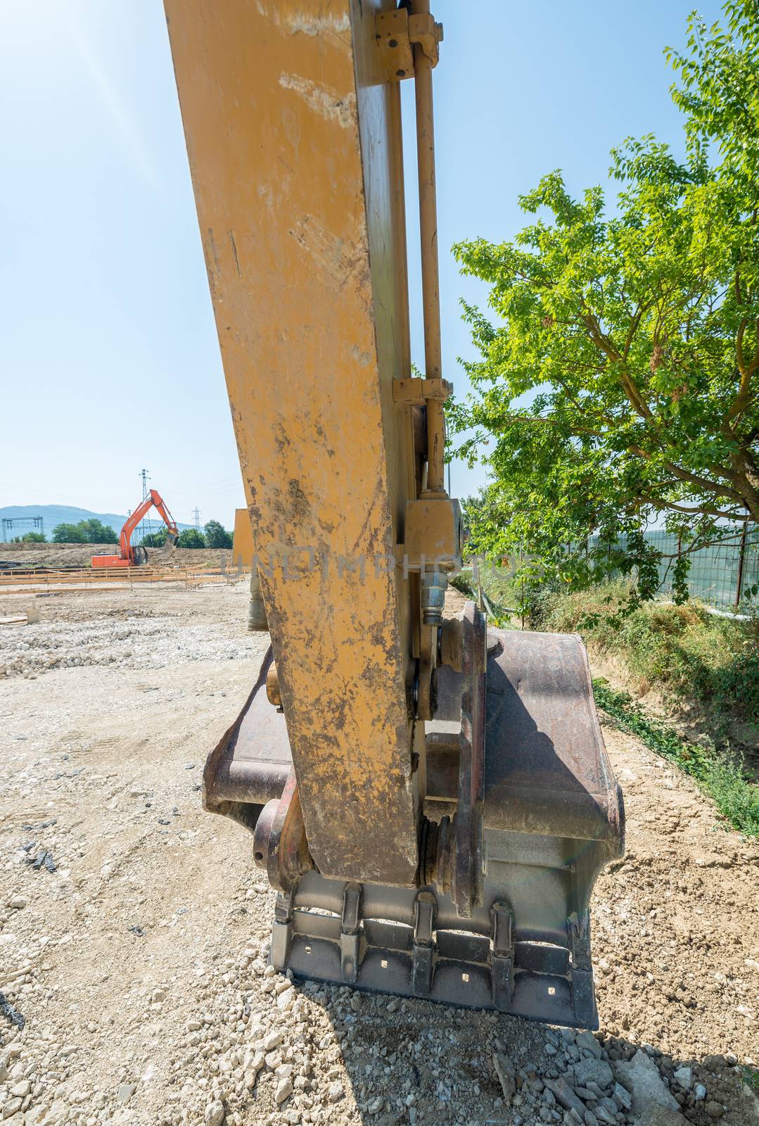 Excavator on construction site by jovannig